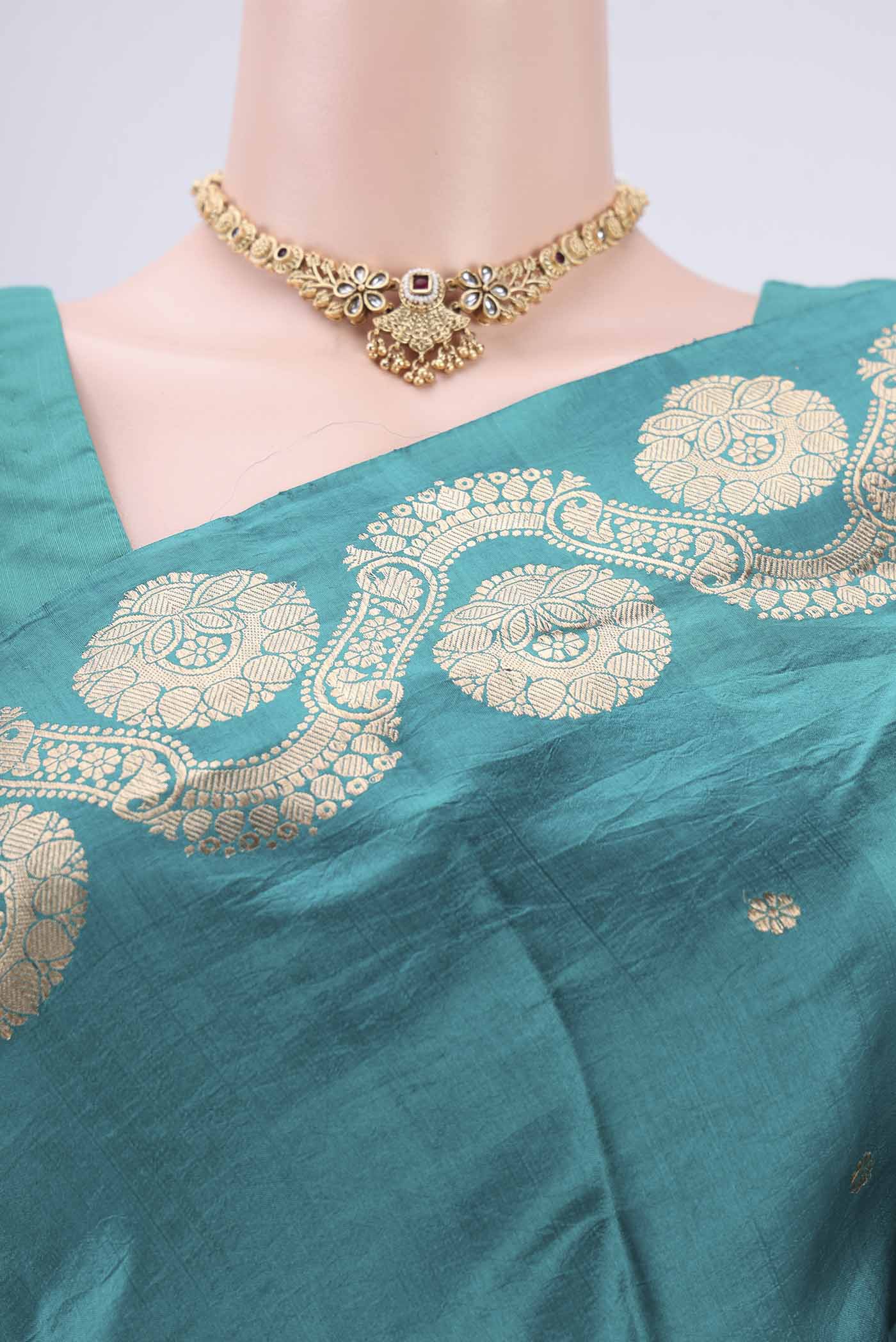 Border image of Turquoise Banarasi Katan Silk Saree with Zari Butta on the body and Zari Border. 