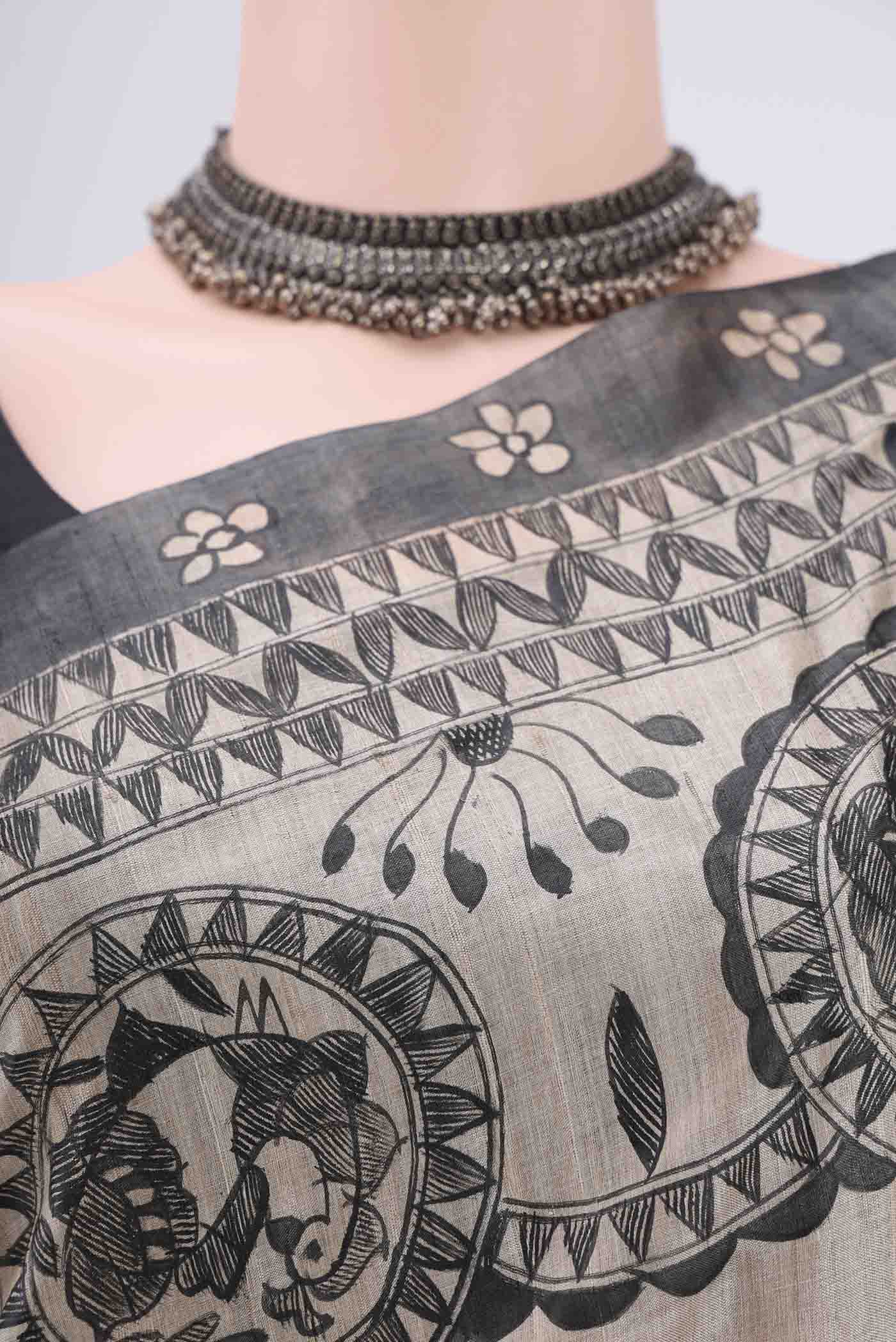 Border image of Beige Tussar Silk Saree with Printed design on the body and Without Border. 