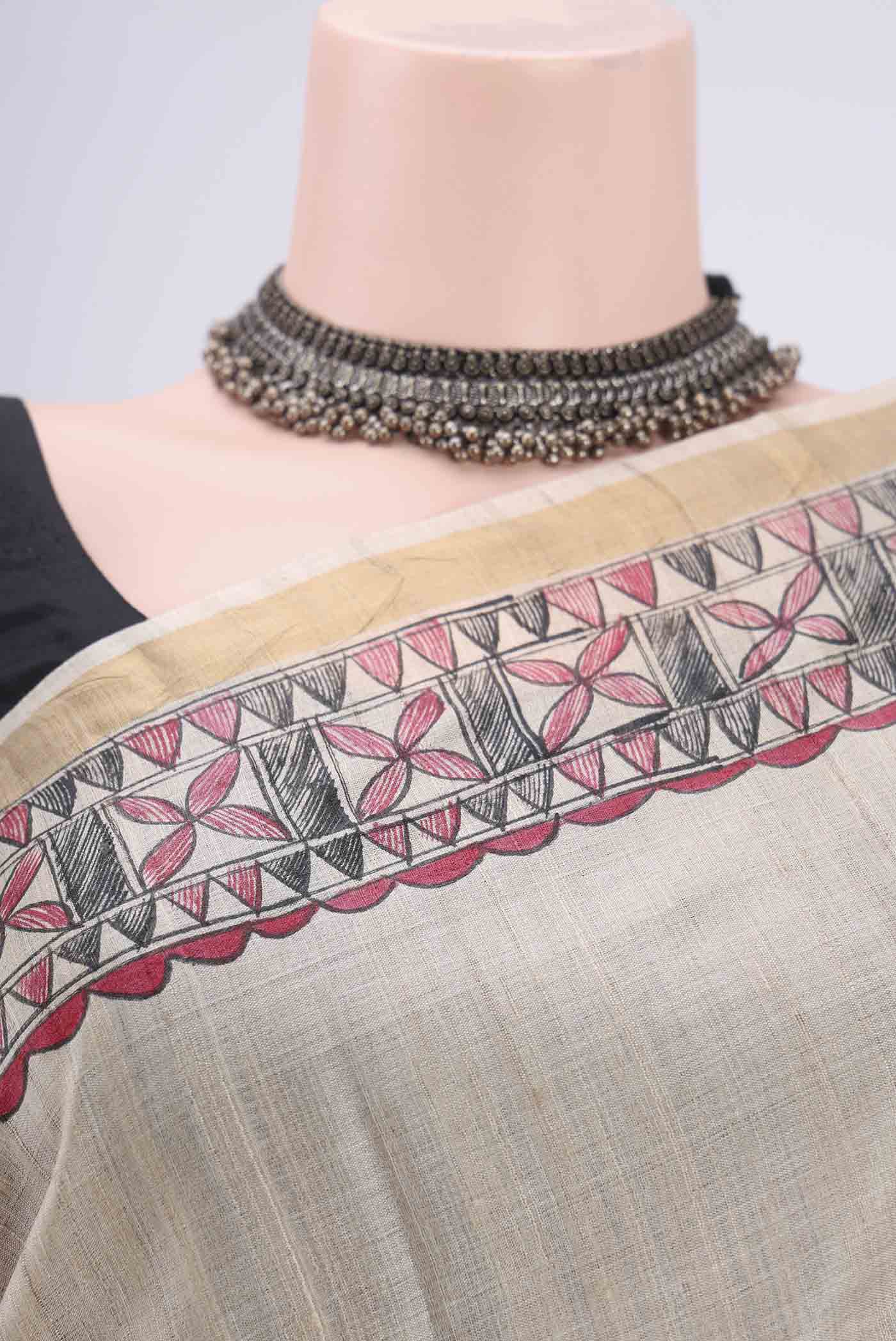 Border image of Beige Tussar Silk Saree with Printed design on the body and Zari Border. 
