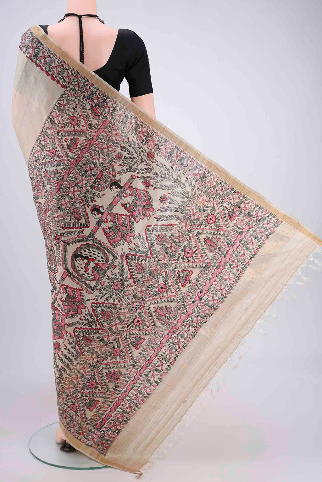 Flat view of Beige Tussar Silk Saree with Printed design on the body and Zari Border. 