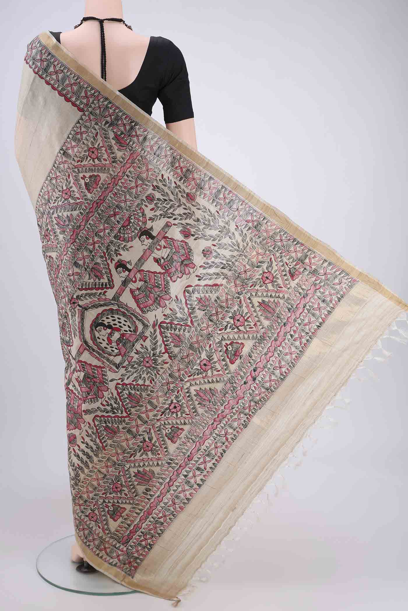 Flat view of Beige Tussar Silk Saree with Printed design on the body and Zari Border. 