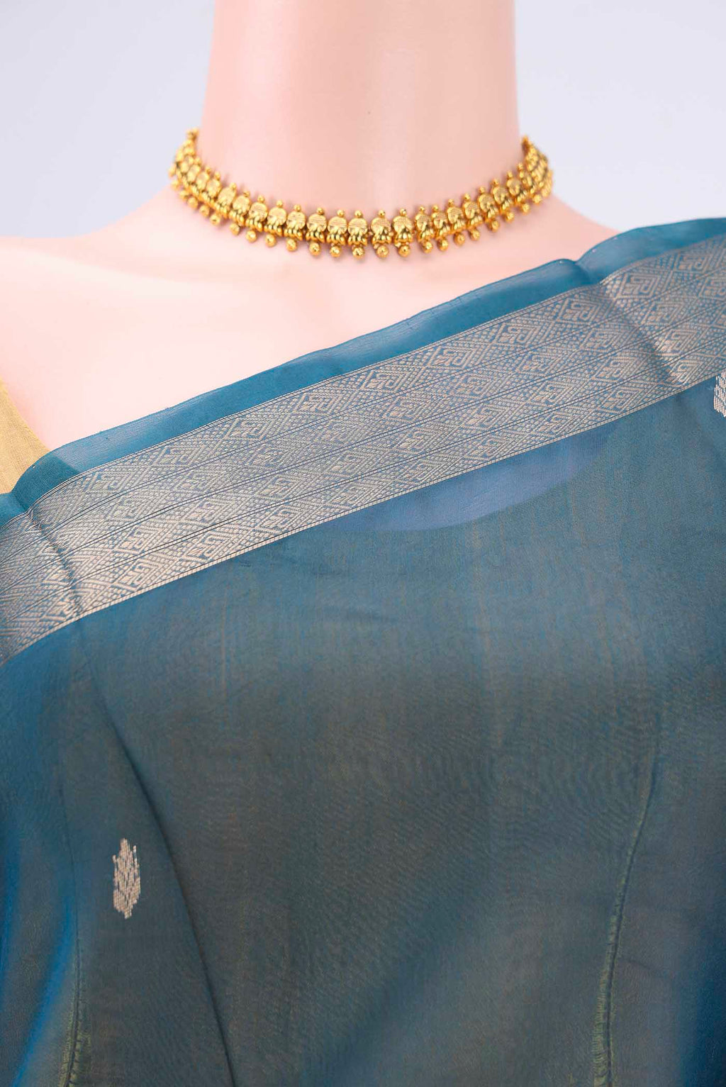 Border image of Turquoise Organza Silk Saree with Plain Body and Zari Border. 