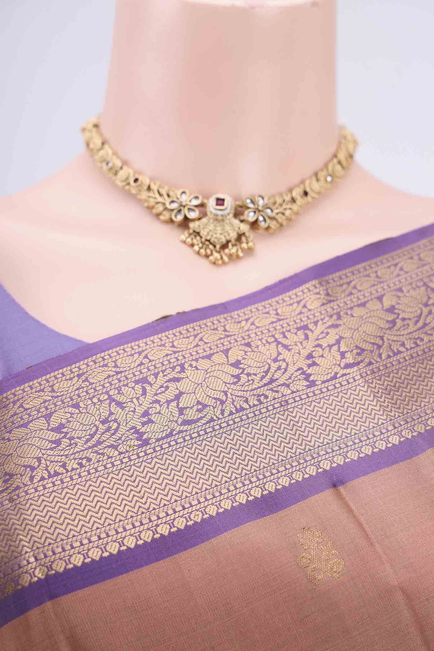 Border image of Rose Gold Soft Silk Saree with Zari Butta on the body and Zari Border. 
