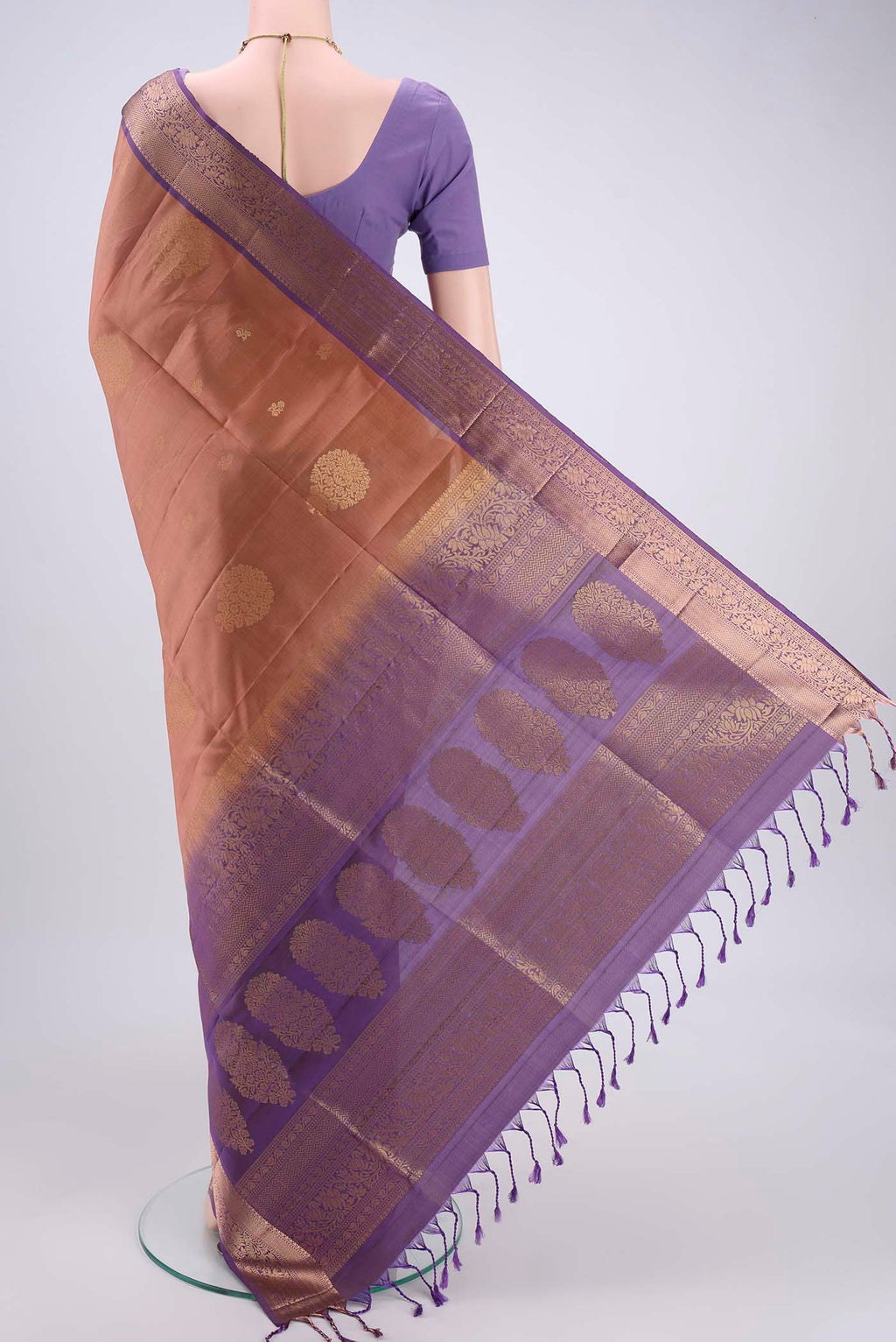 Flat view of Rose Gold Soft Silk Saree with Zari Butta on the body and Zari Border. 