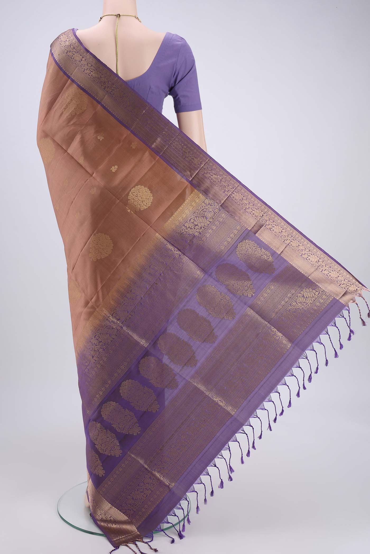 Flat view of Rose Gold Soft Silk Saree with Zari Butta on the body and Zari Border. 