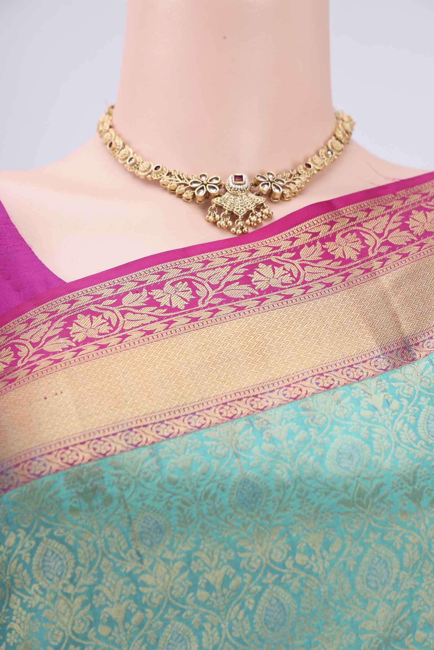 Border image of Turquoise Soft Silk Saree with Zari Brocade on the body and Zari Border. 