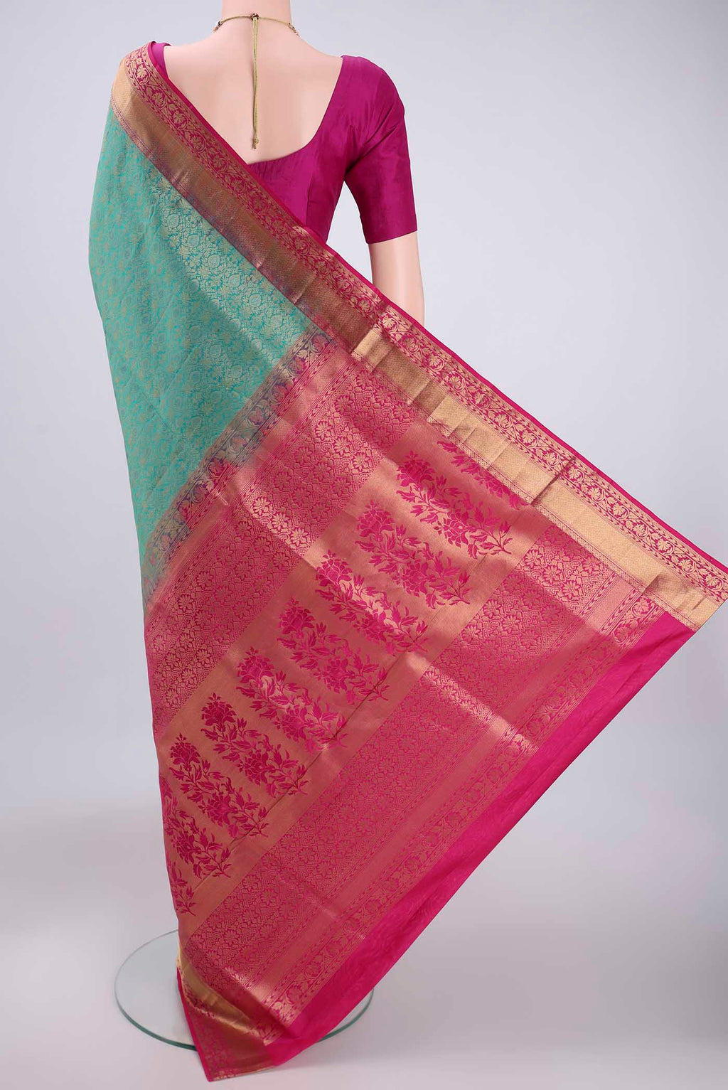 Flat view of Turquoise Soft Silk Saree with Zari Brocade on the body and Zari Border. 