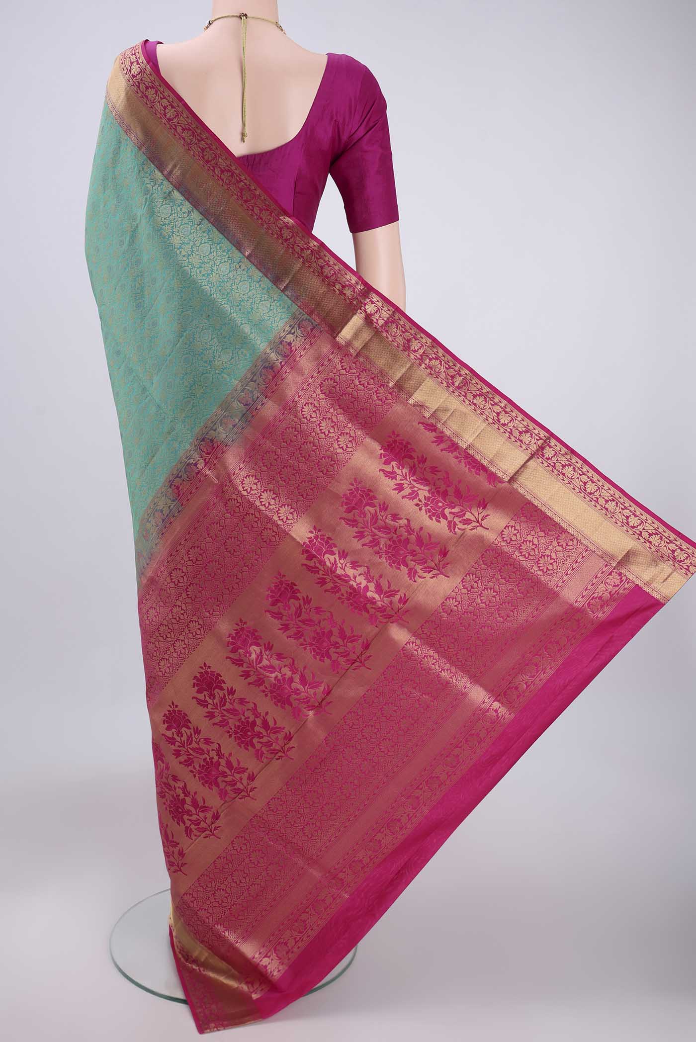Flat view of Turquoise Soft Silk Saree with Zari Brocade on the body and Zari Border. 