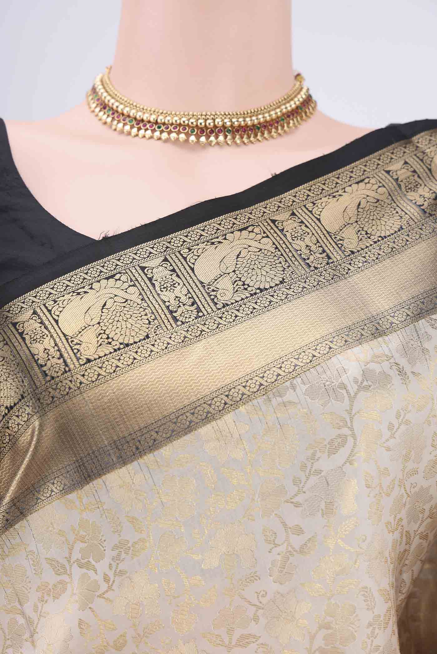 Border image of Cream Dual Tone Soft Silk Saree with Zari Brocade on the body and Zari Border. 