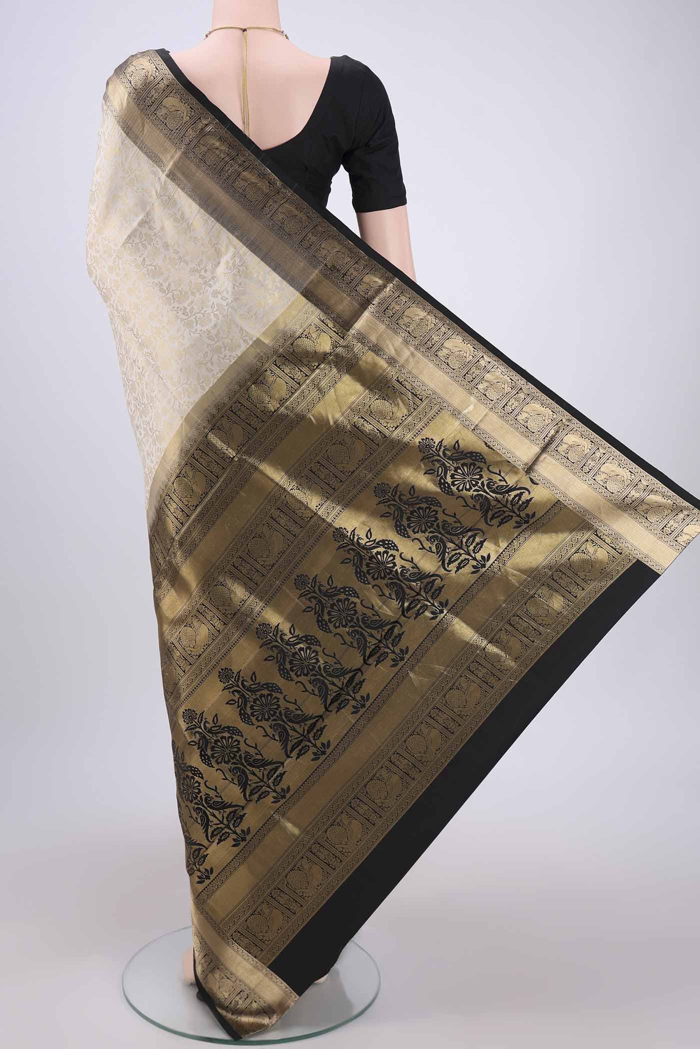 Flat view of Cream Dual Tone Soft Silk Saree with Zari Brocade on the body and Zari Border. 
