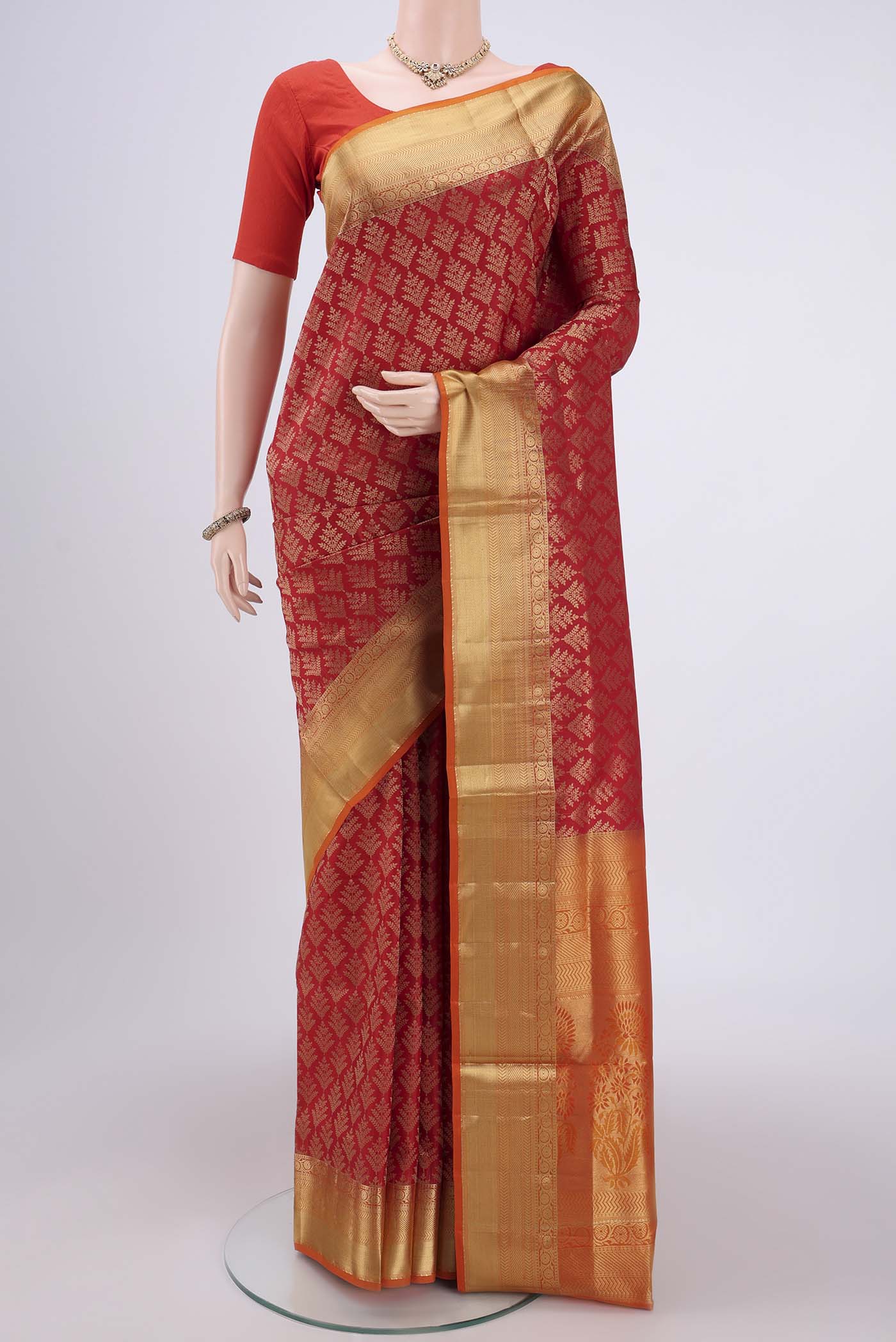 Red Soft Silk Saree with Zari Brocade on the body and Zari Border.  displayed on a mannequin