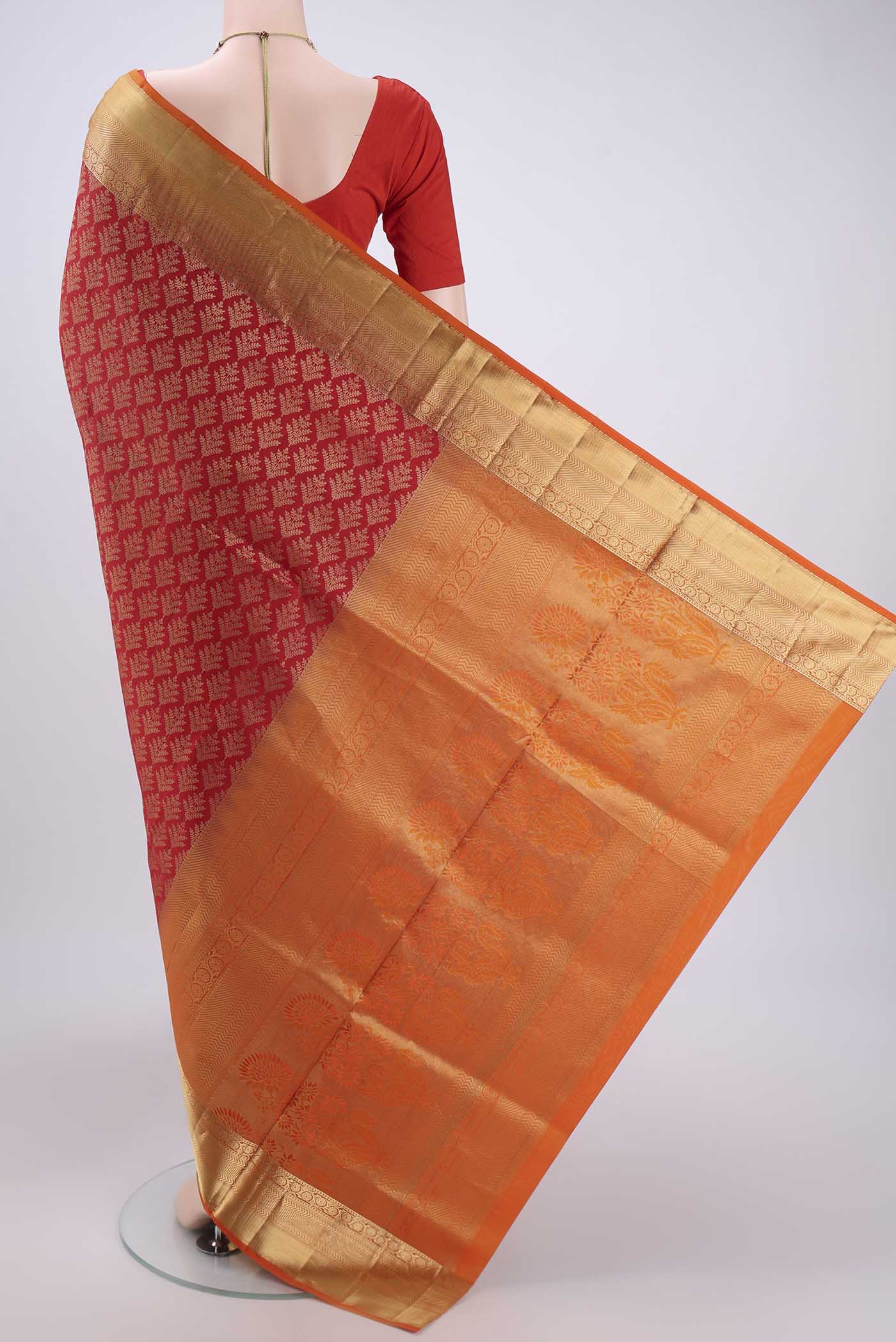 Flat view of Red Soft Silk Saree with Zari Brocade on the body and Zari Border. 
