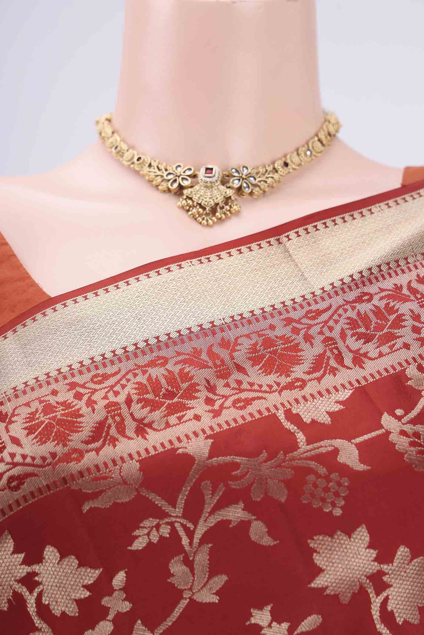 Border image of Rust Soft Silk Saree with Zari Brocade on the body and Zari Border. 