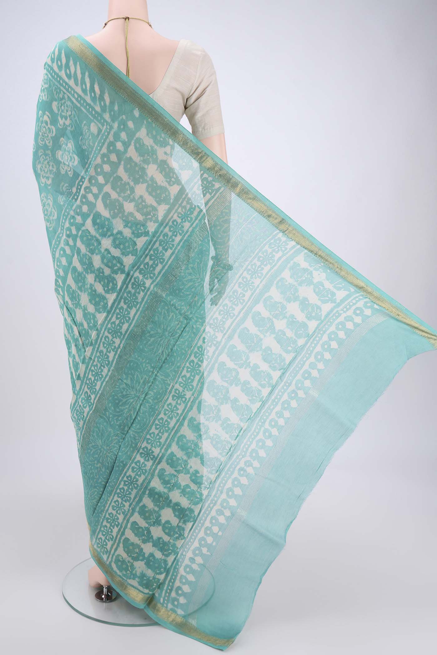 Flat view of Light Green Maheshwari Silk Cotton Saree with Batik Print on the body and Zari Border. 