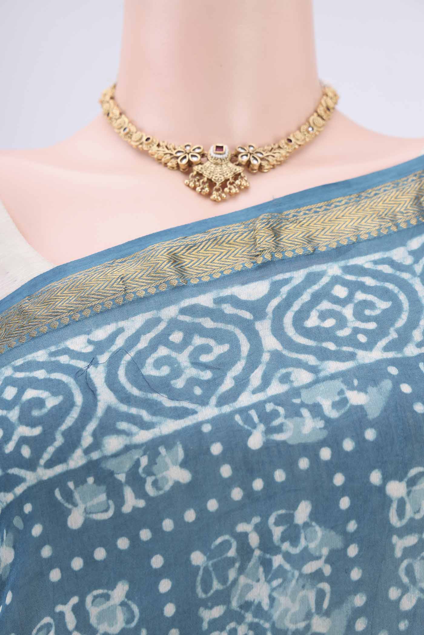 Border image of Blue Maheshwari Silk Cotton Saree with Batik Print on the body and Zari Border. 