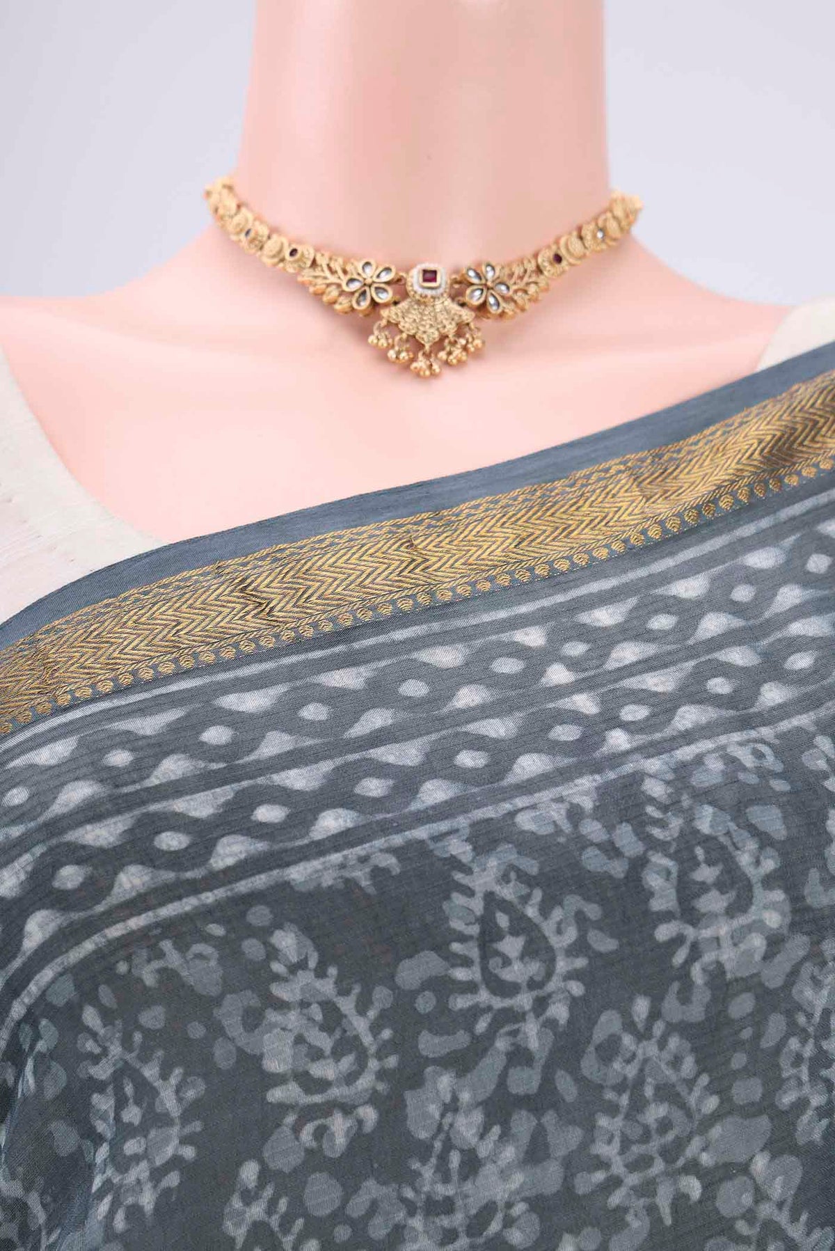 Border image of Sage Green Maheshwari Silk Cotton Saree with Batik Print on the body and Zari Border. 