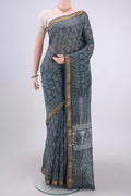 Sage Green Maheshwari Silk Cotton Saree with Batik Print on the body and Zari Border.  displayed on a mannequin