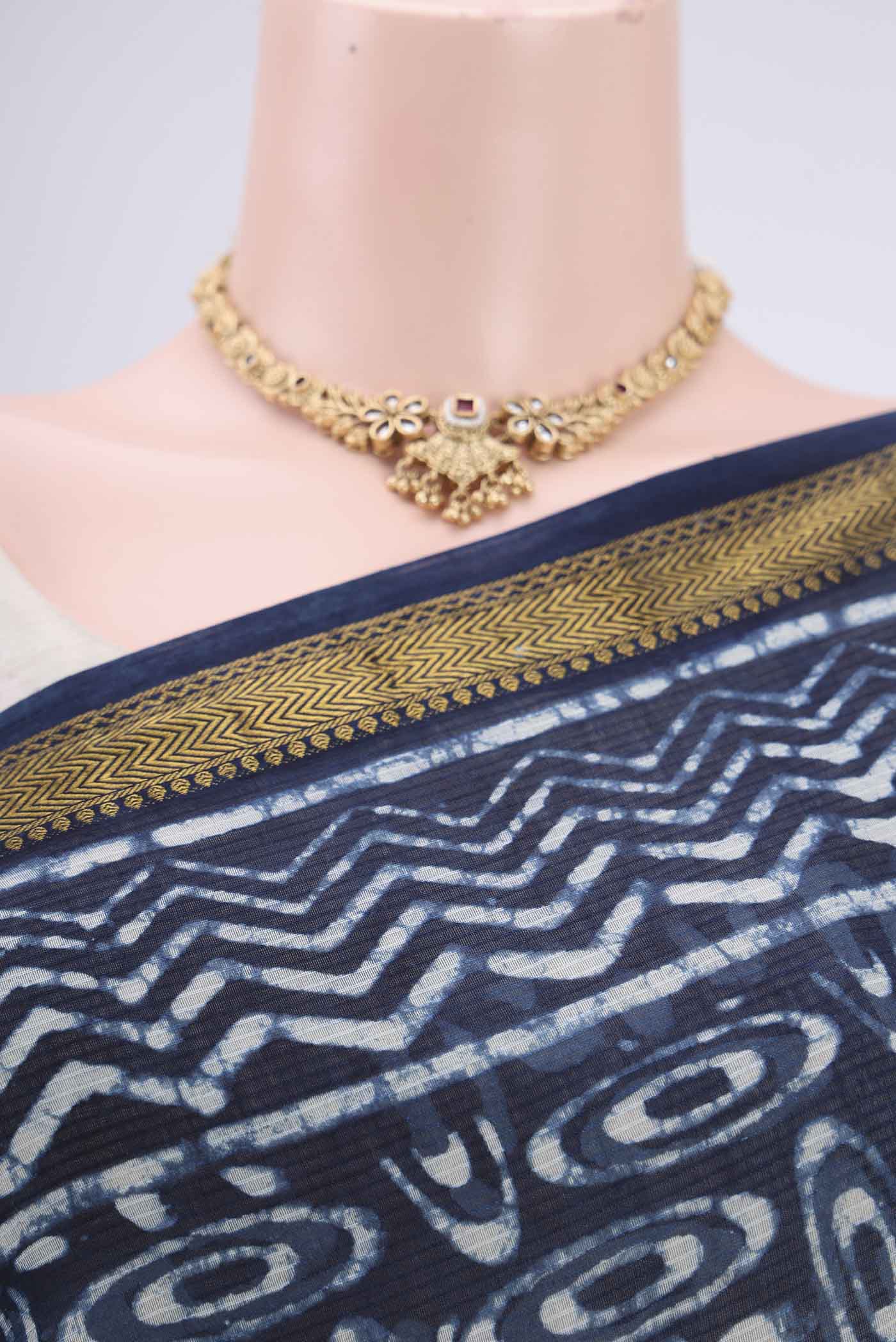 Border image of Indigo Maheshwari Silk Cotton Saree with Batik Print on the body and Zari Border. 