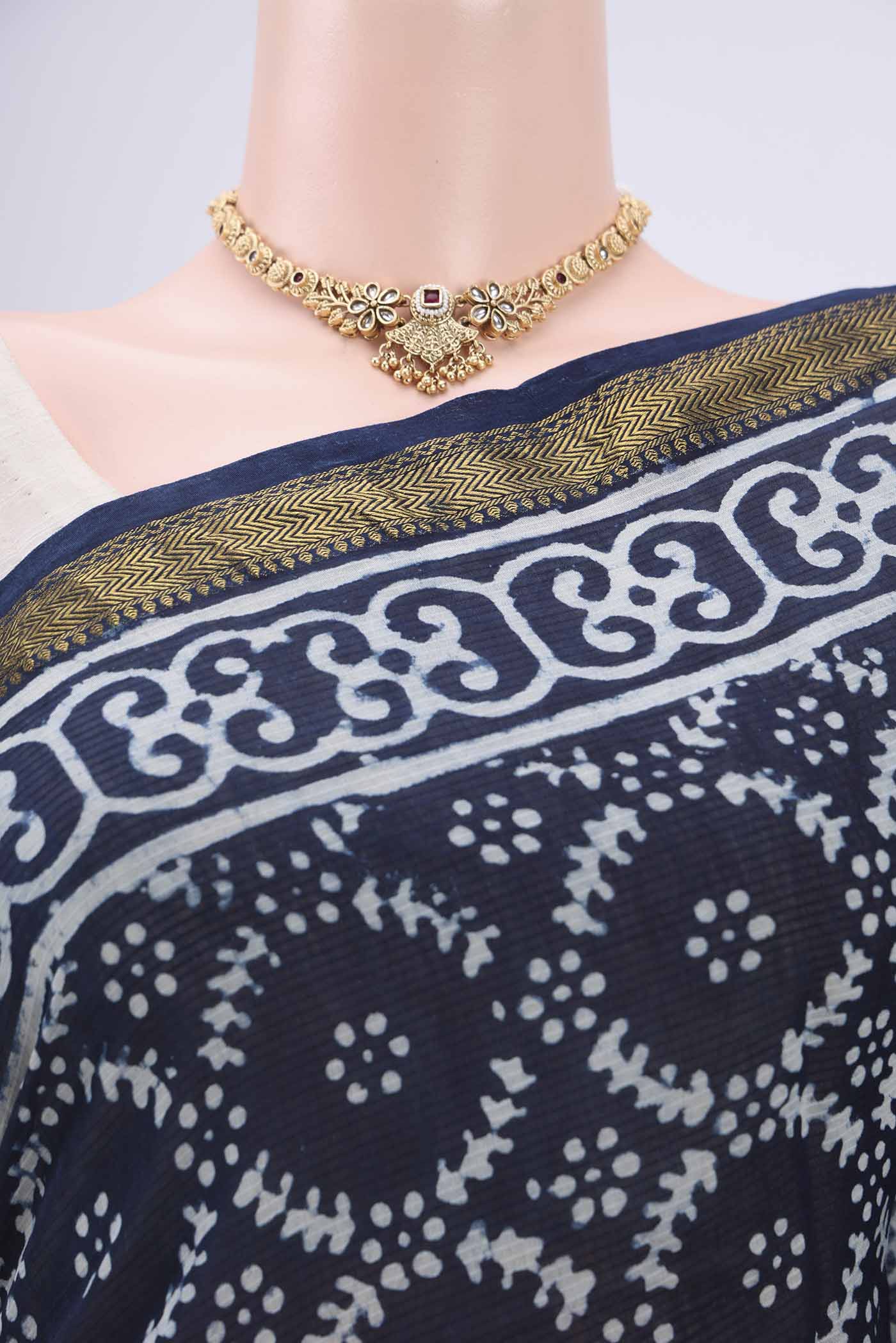 Border image of Indigo Maheshwari Silk Cotton Saree with Batik Print on the body and Zari Border. 