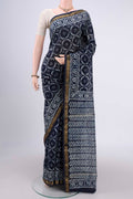 Indigo Maheshwari Silk Cotton Saree with Batik Print on the body and Zari Border.  displayed on a mannequin