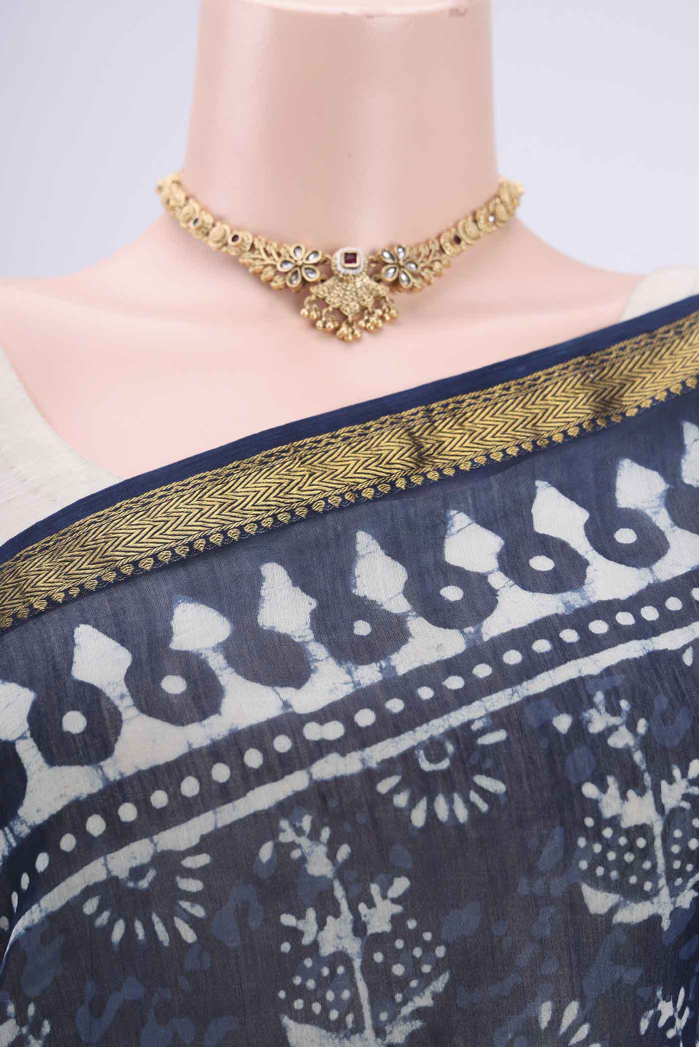 Border image of Indigo Maheshwari Silk Cotton Saree with Batik Print on the body and Zari Border. 