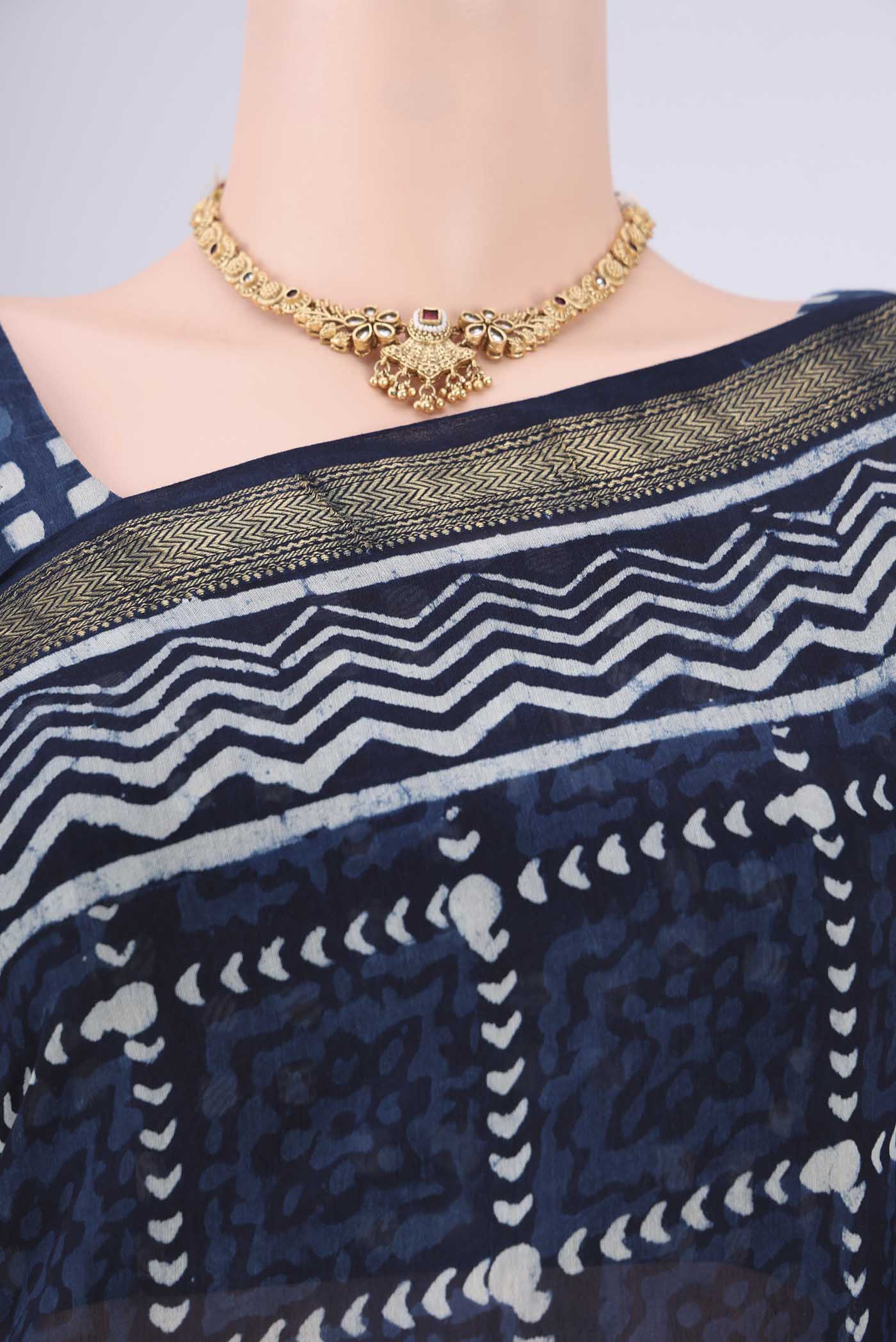 Border image of Indigo Maheshwari Silk Cotton Saree with Batik Print on the body and Zari Border. 