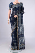 Indigo Maheshwari Silk Cotton Saree with Batik Print on the body and Zari Border.  displayed on a mannequin