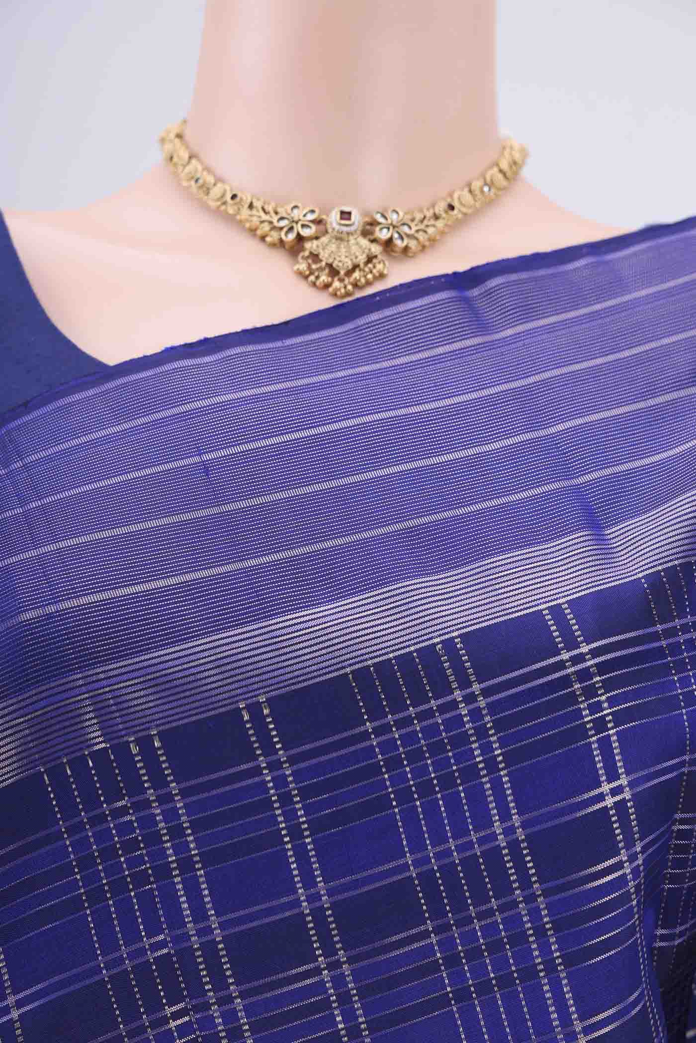 Border image of Royal Blue Dual Tone Kanjivaram Silk Saree with Checked design on the body and Zari Border. 