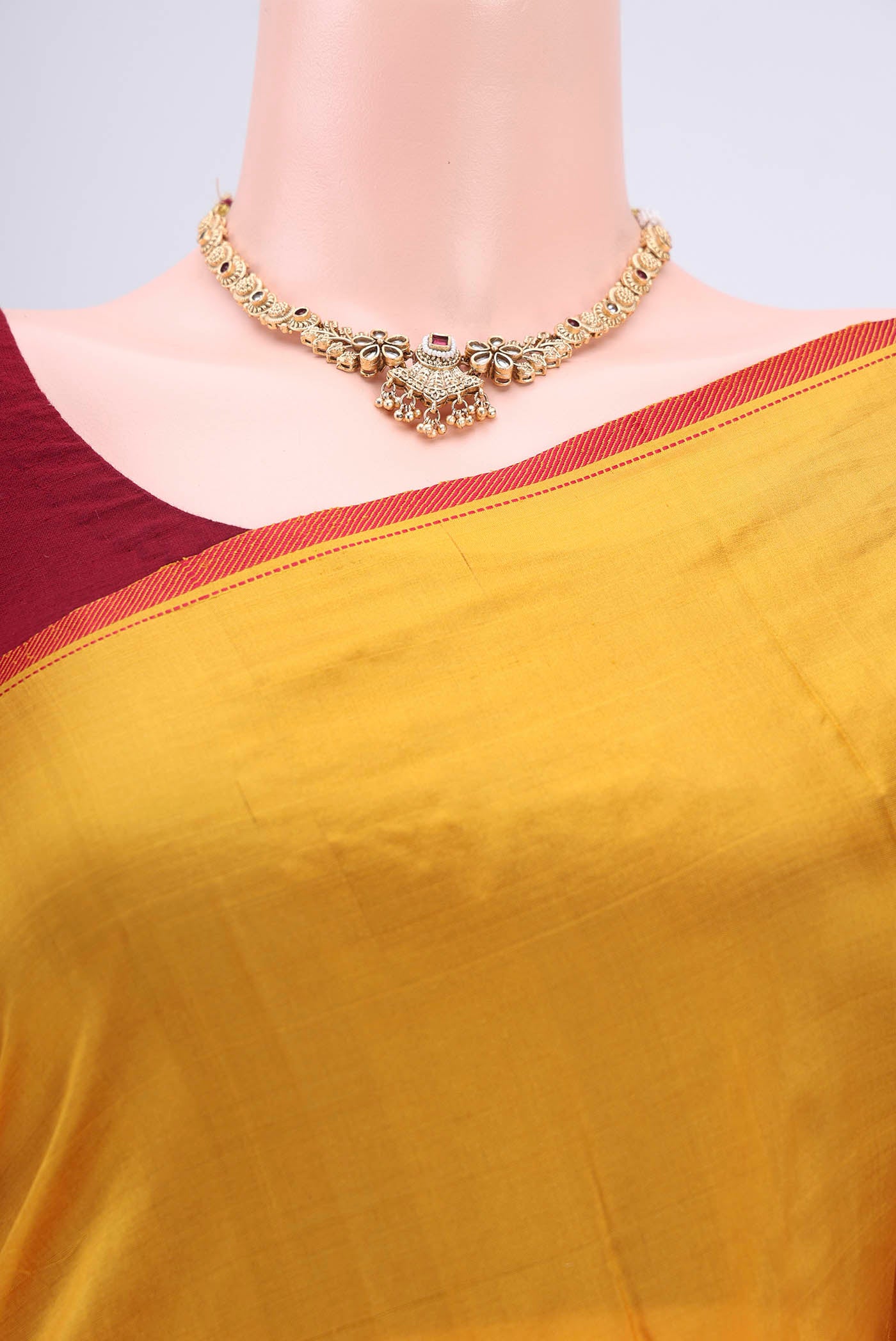 Border image of Yellow Kanchipuram Silk Saree with Plain Body and Thread Border. 
