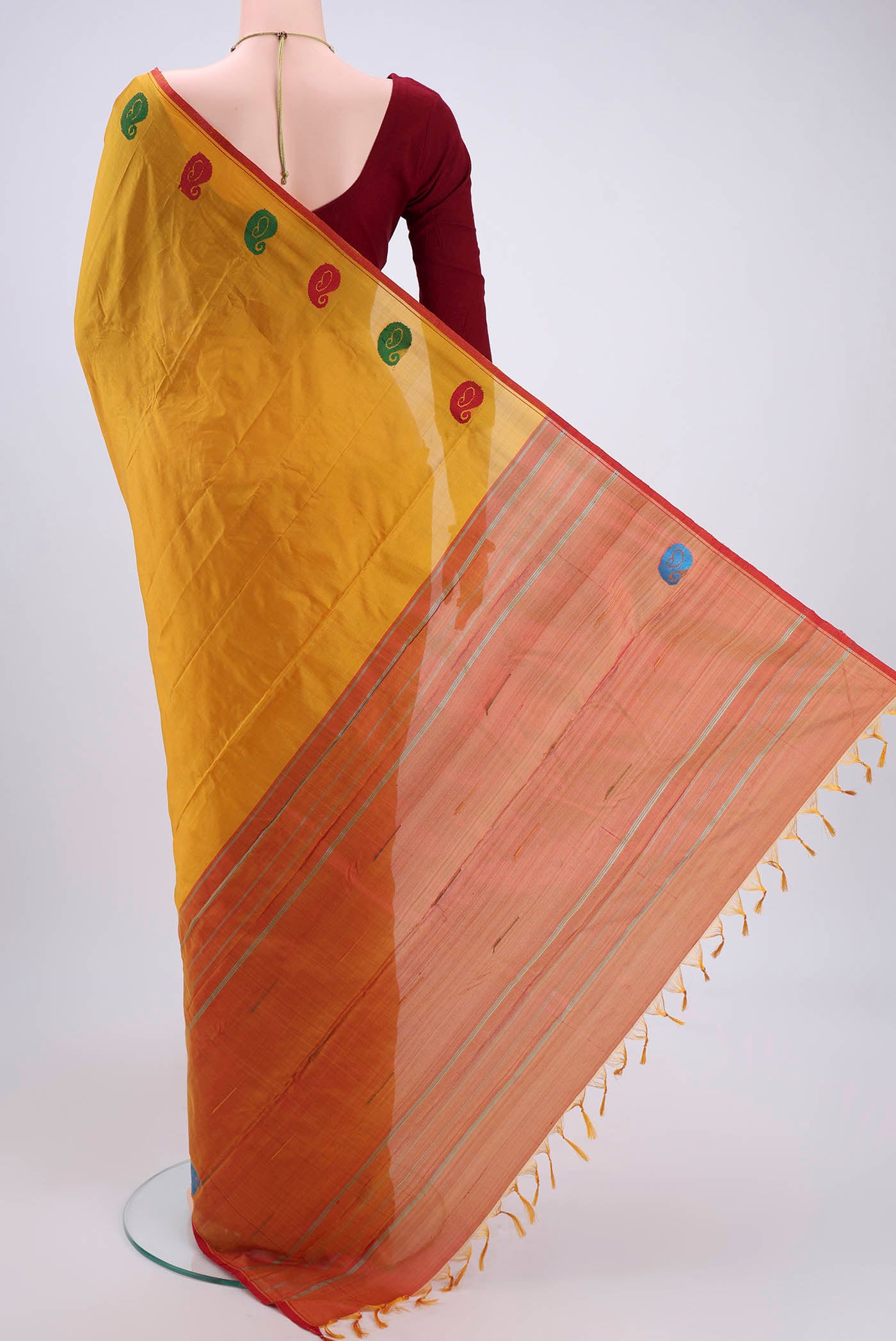 Flat view of Yellow Kanchipuram Silk Saree with Plain Body and Thread Border. 