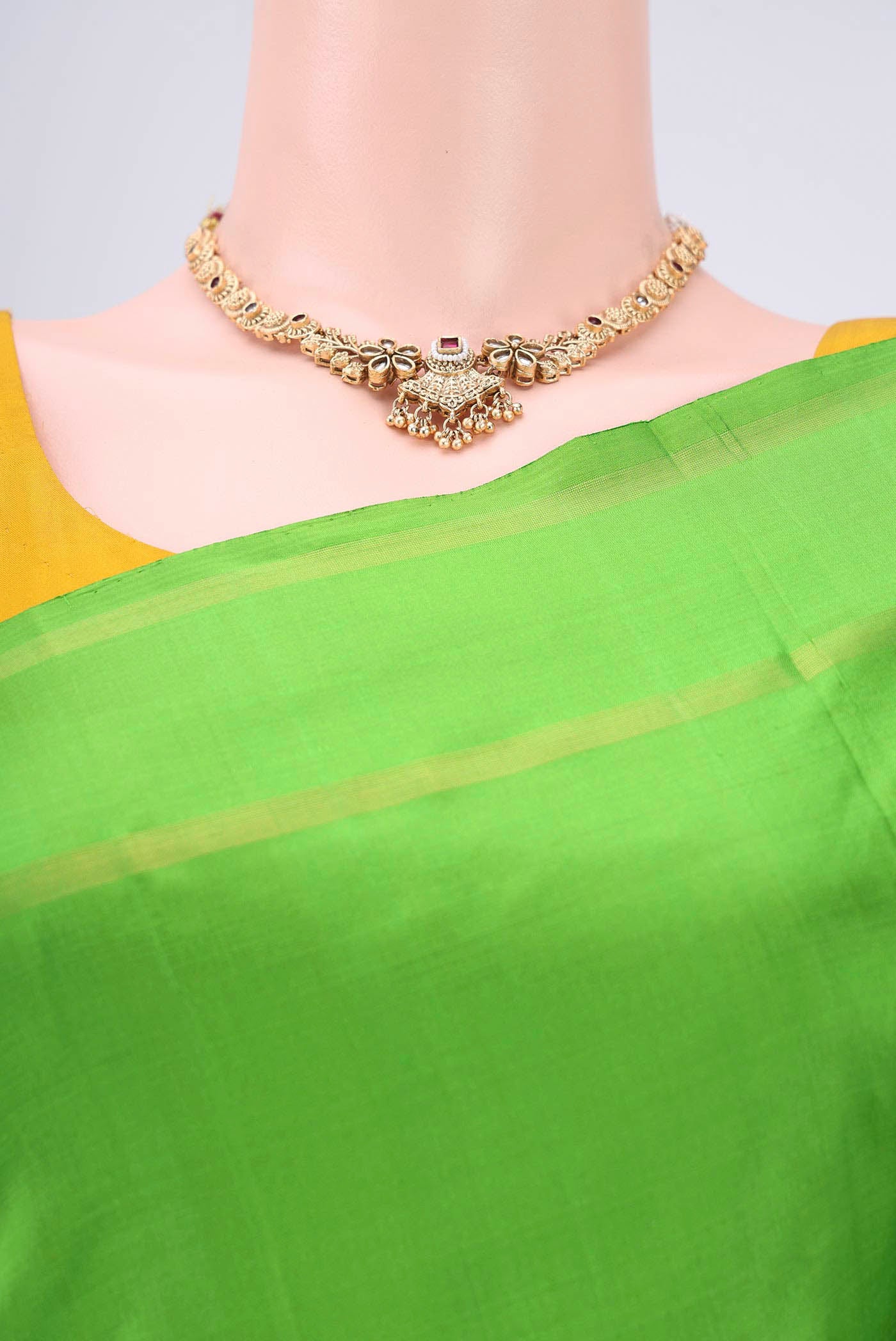 Border image of Light Green Dual Tone Kanchipuram Silk Saree with Plain Body and Zari And Thread Border. 