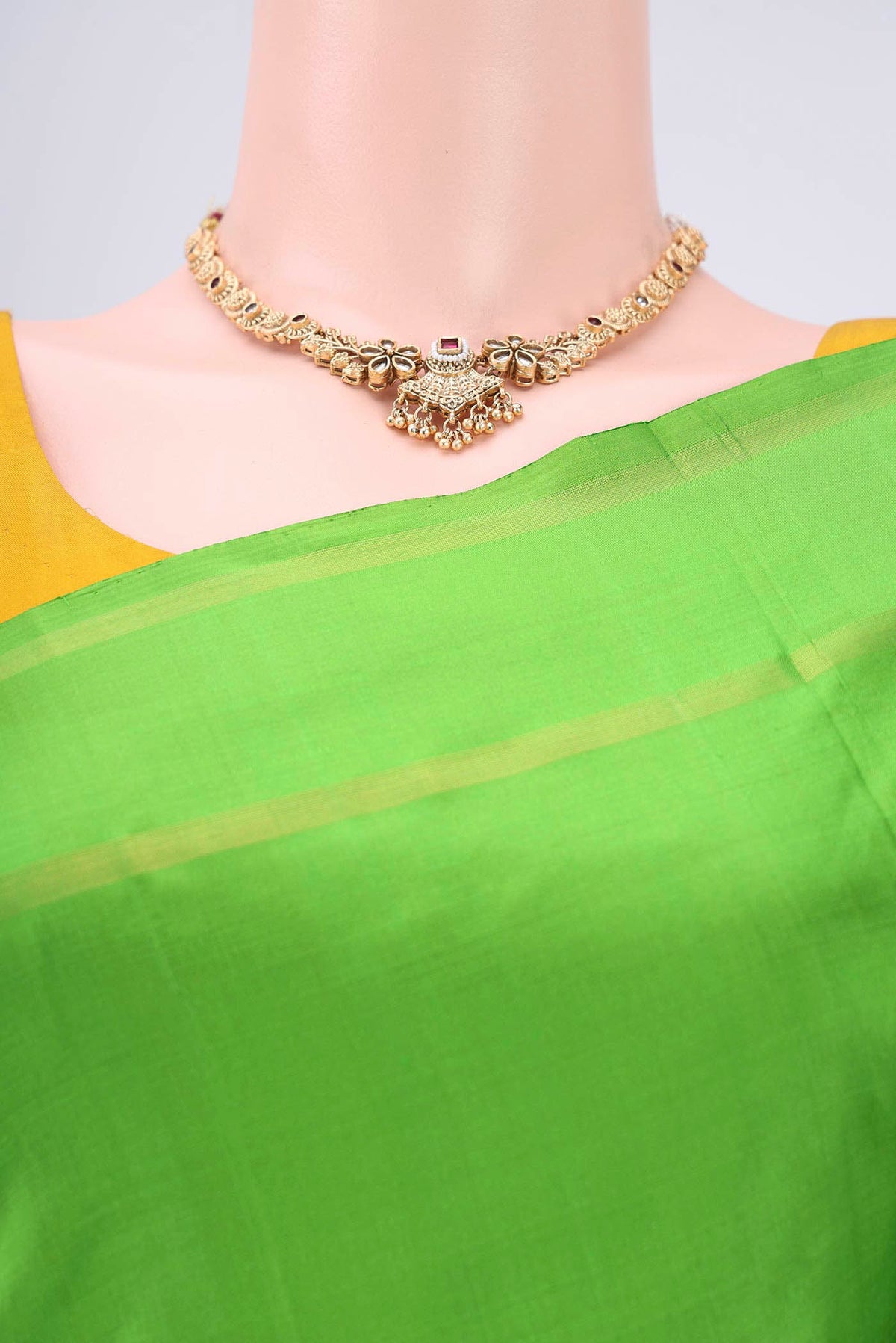 Border image of Light Green Dual Tone Kanchipuram Silk Saree with Plain Body and Zari And Thread Border. 