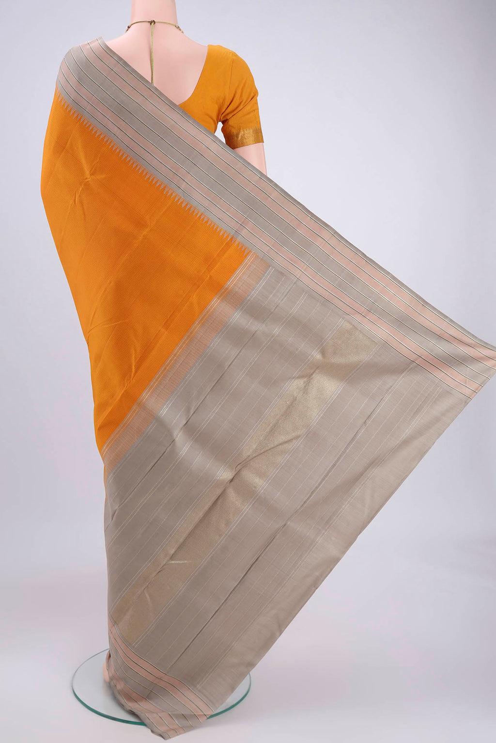 Flat view of Yellow Kanjivaram Silk Saree with Checked design on the body and Zari Border. 