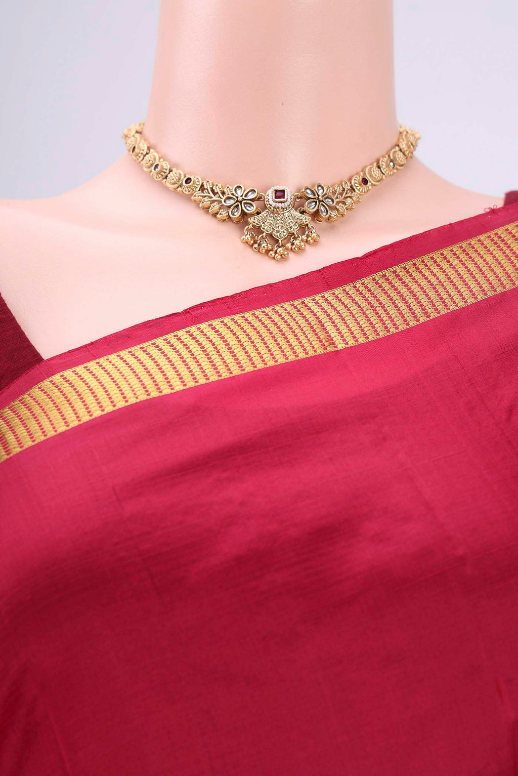 Border image of Maroon Kanchipuram Silk Saree with Plain Body and Zari Border. 