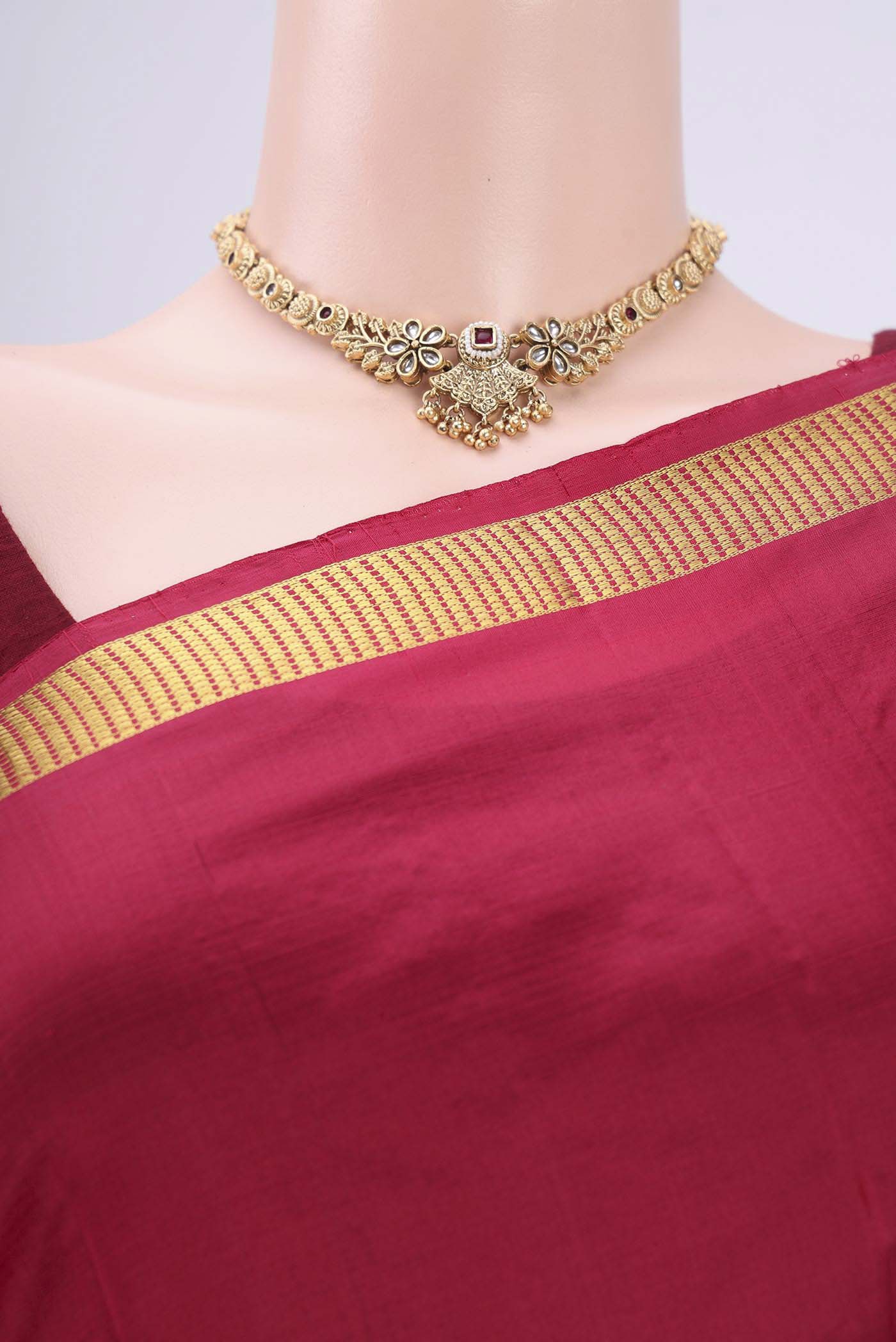 Border image of Maroon Kanchipuram Silk Saree with Plain Body and Zari Border. 