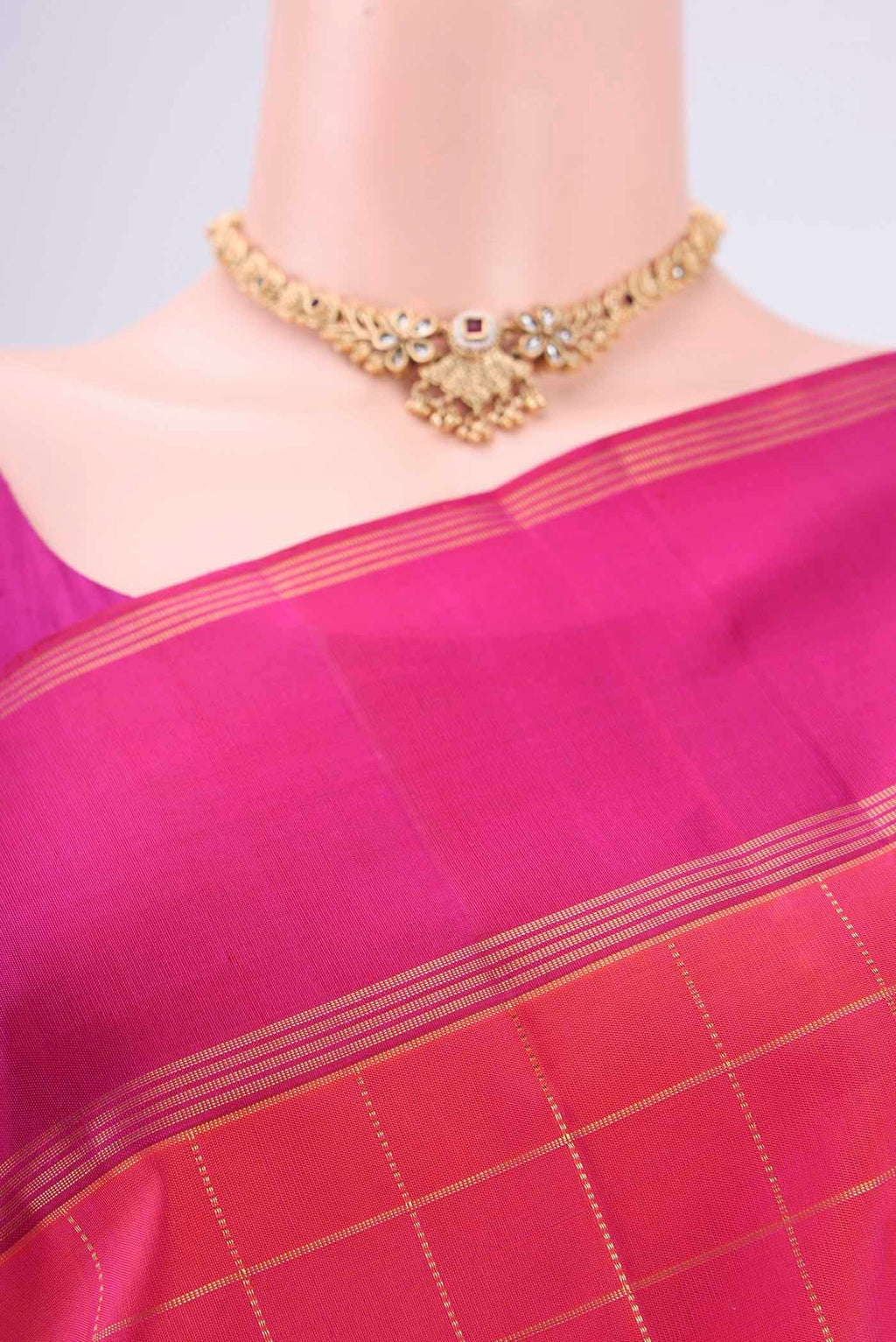 Border image of Maroon Dual Tone Kanchipuram Silk Saree with Checked design on the body and Zari Border. 