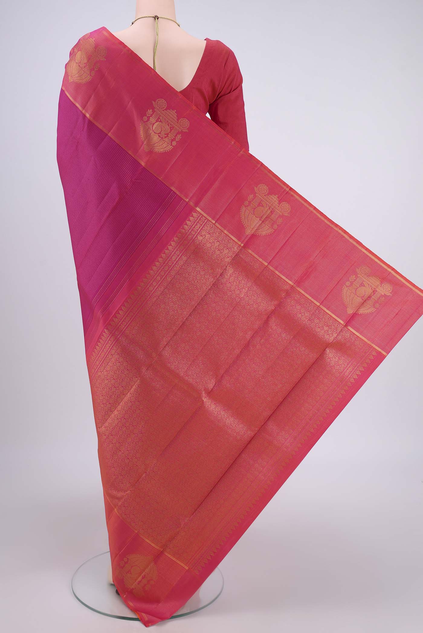 Flat view of Dark Pink Kanjivaram Silk Saree with Stripes on the body and Zari Border. 