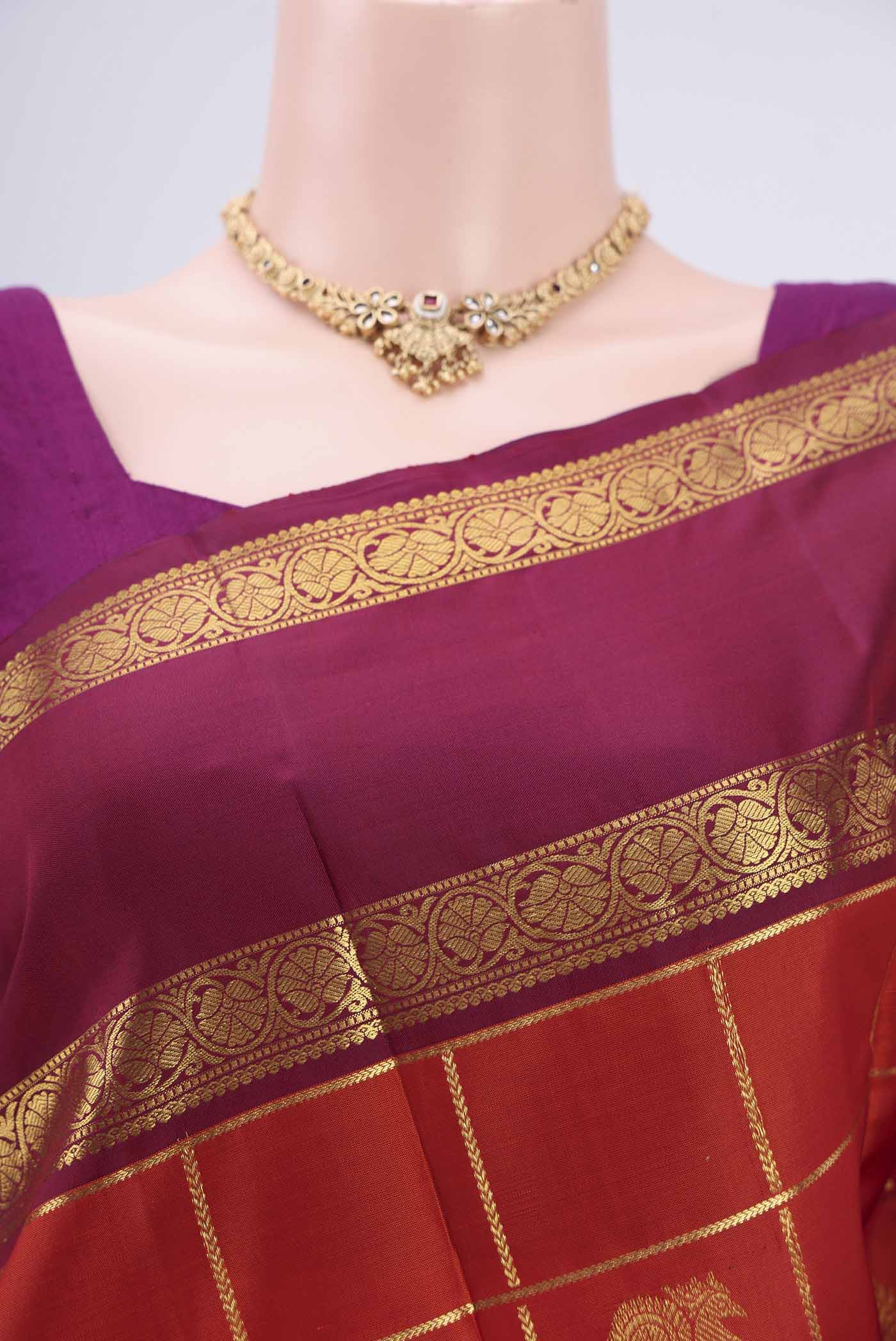 Border image of Rust Kanjivaram Silk Saree with Checked design on the body and Zari Border. 