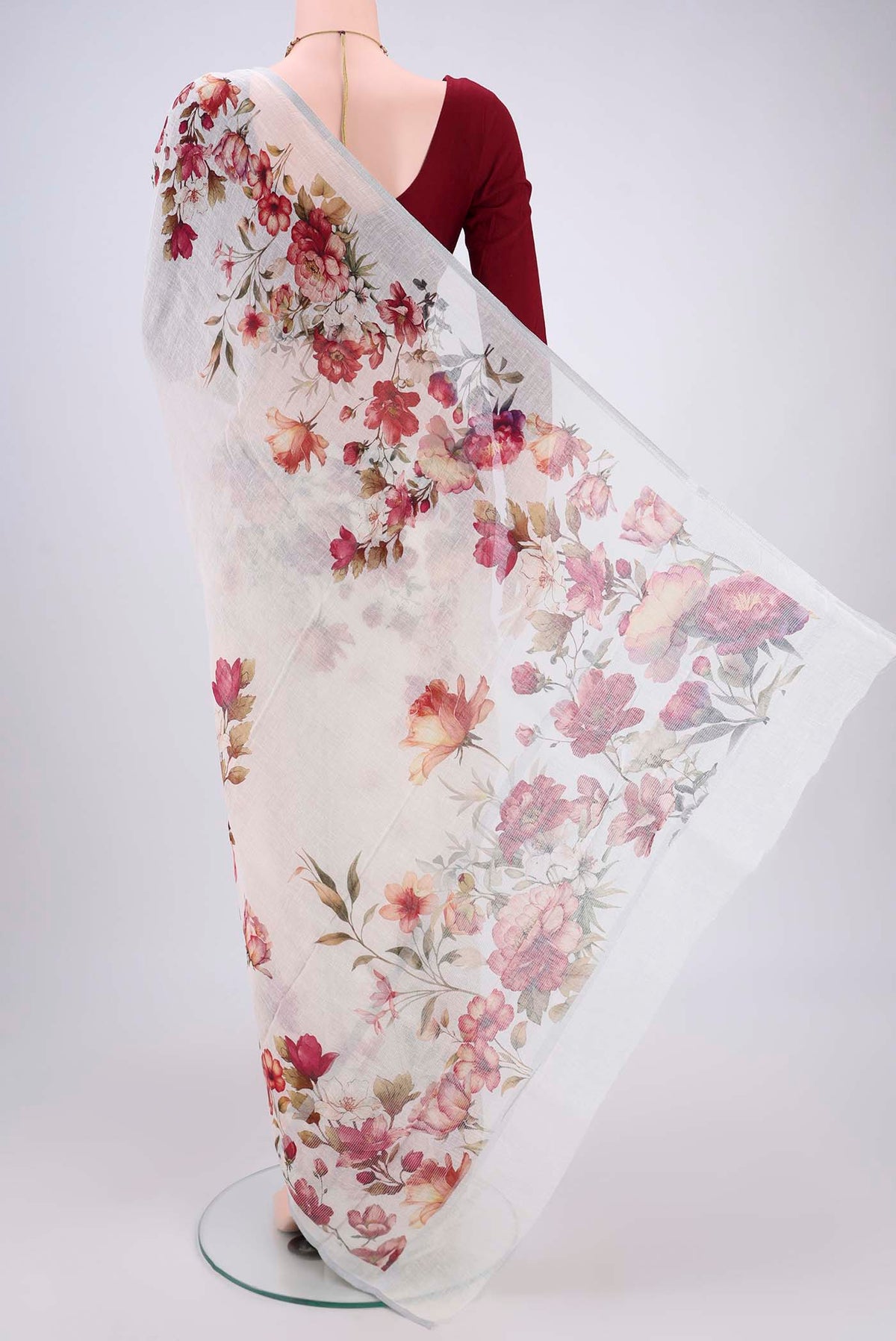 Flat view of Off White Linen Saree with Floral Print on the body and Zari Border. 