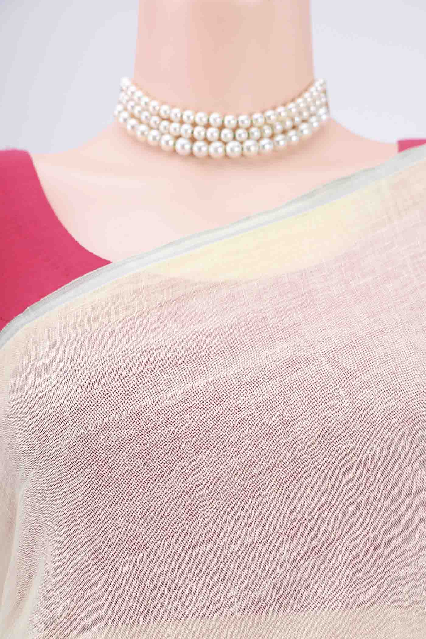 Border image of Mint Green Linen Saree with Floral Print on the body and Zari Border. 
