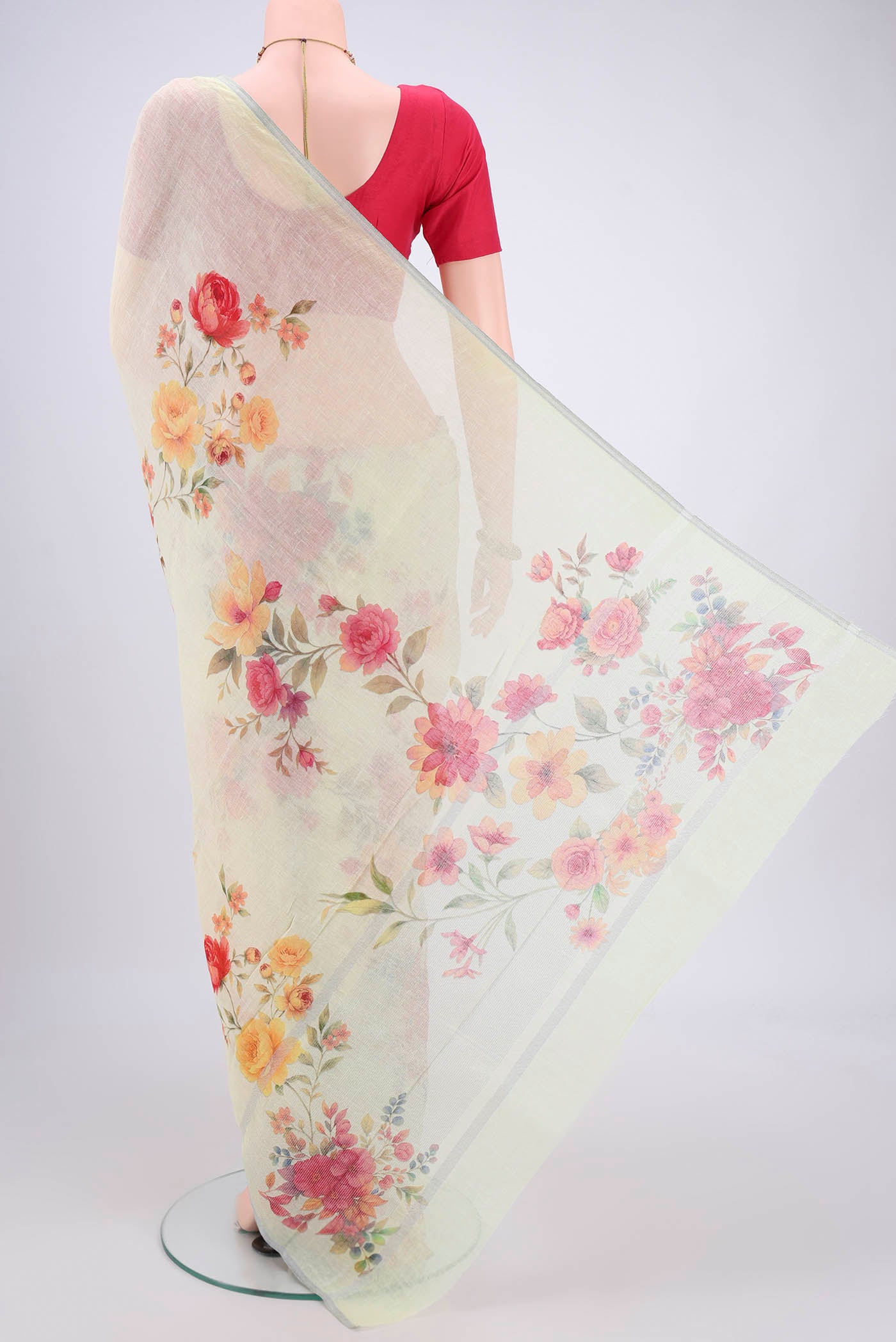 Flat view of Mint Green Linen Saree with Floral Print on the body and Zari Border. 