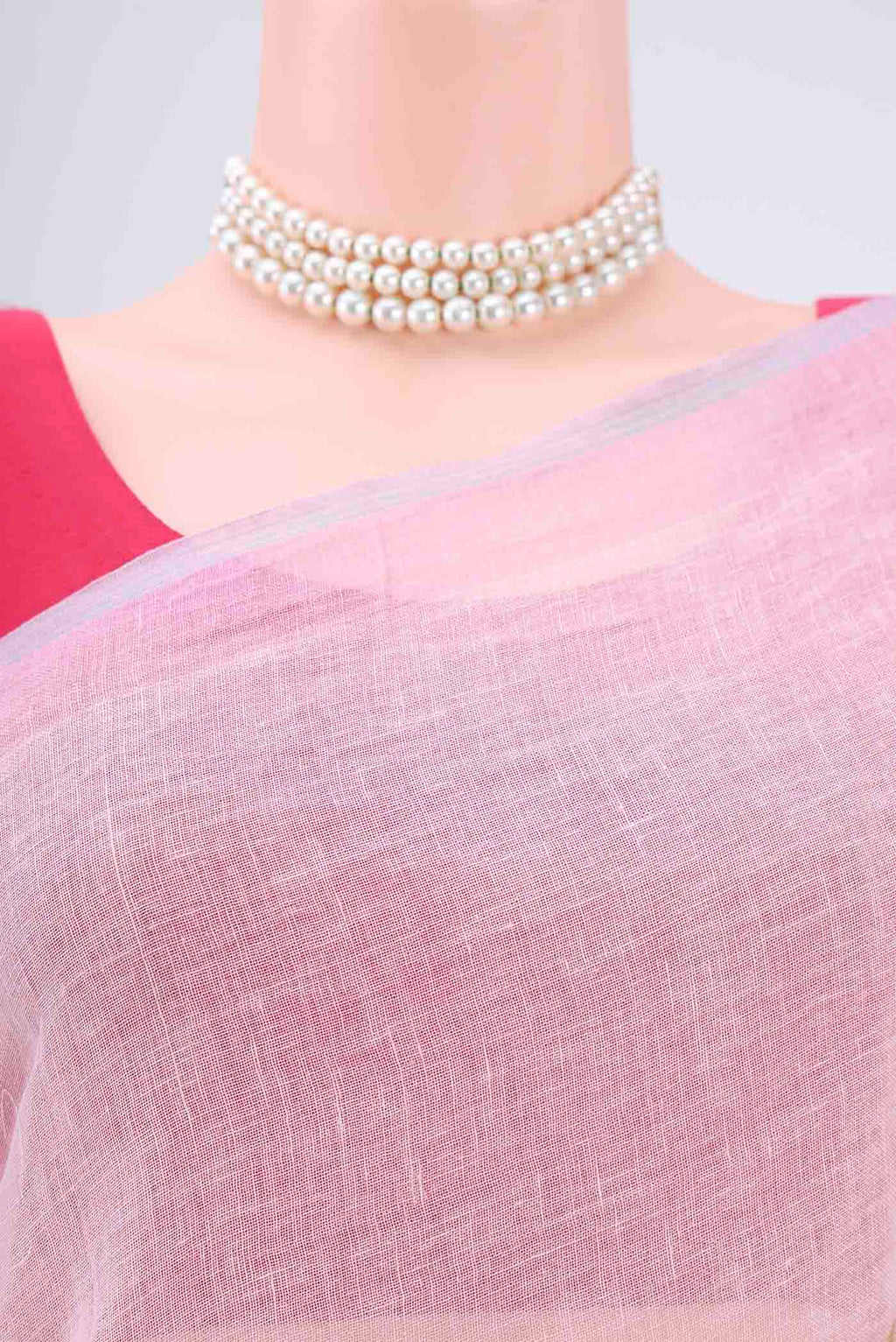 Border image of Pink Linen Saree with Floral Print on the body and Zari Border. 
