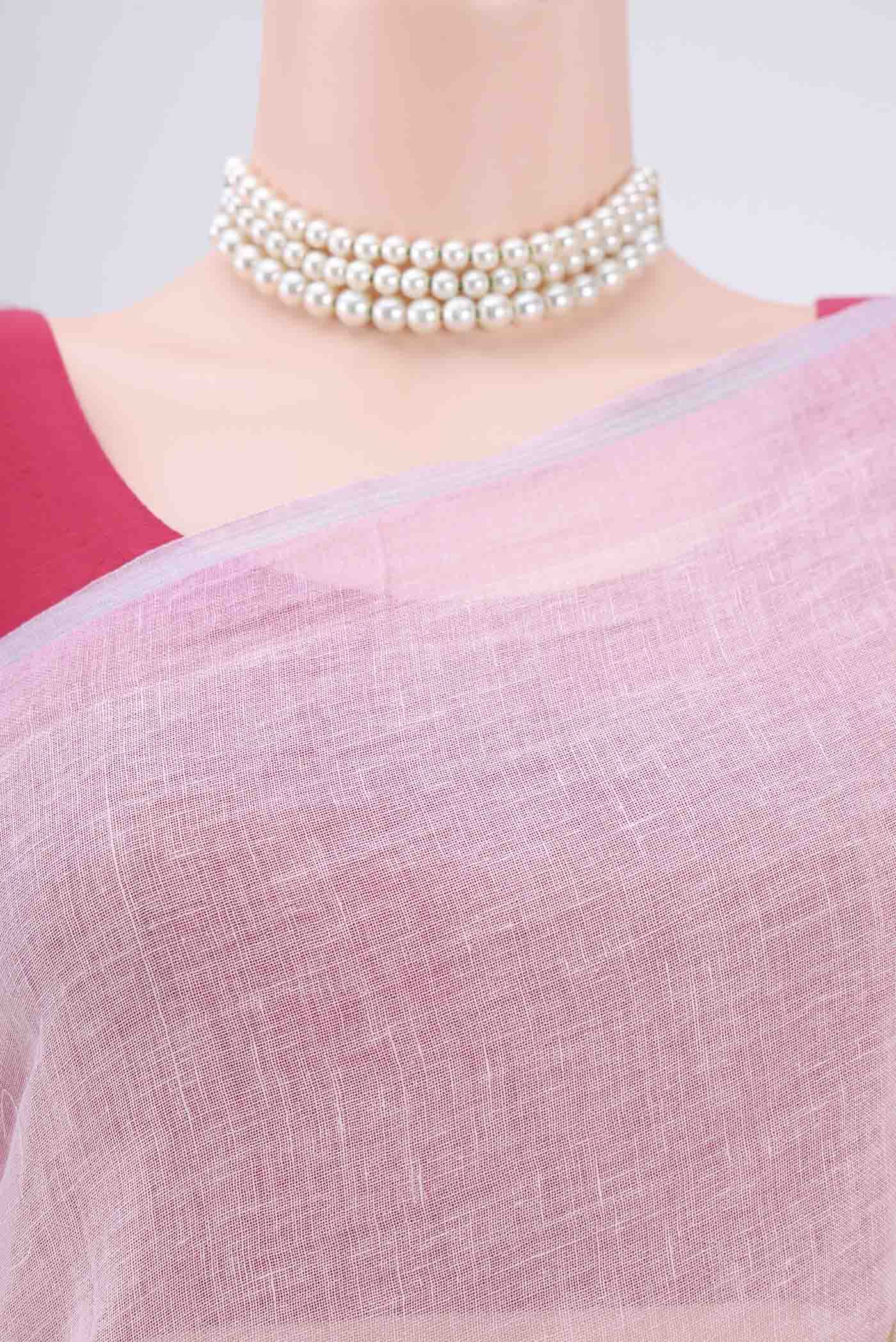 Border image of Pink Linen Saree with Floral Print on the body and Zari Border. 