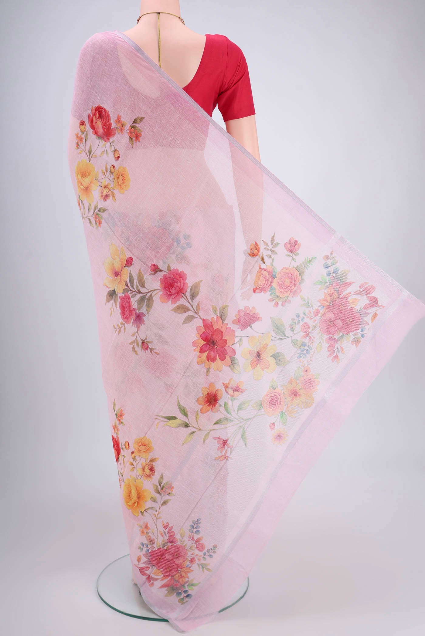 Flat view of Pink Linen Saree with Floral Print on the body and Zari Border. 
