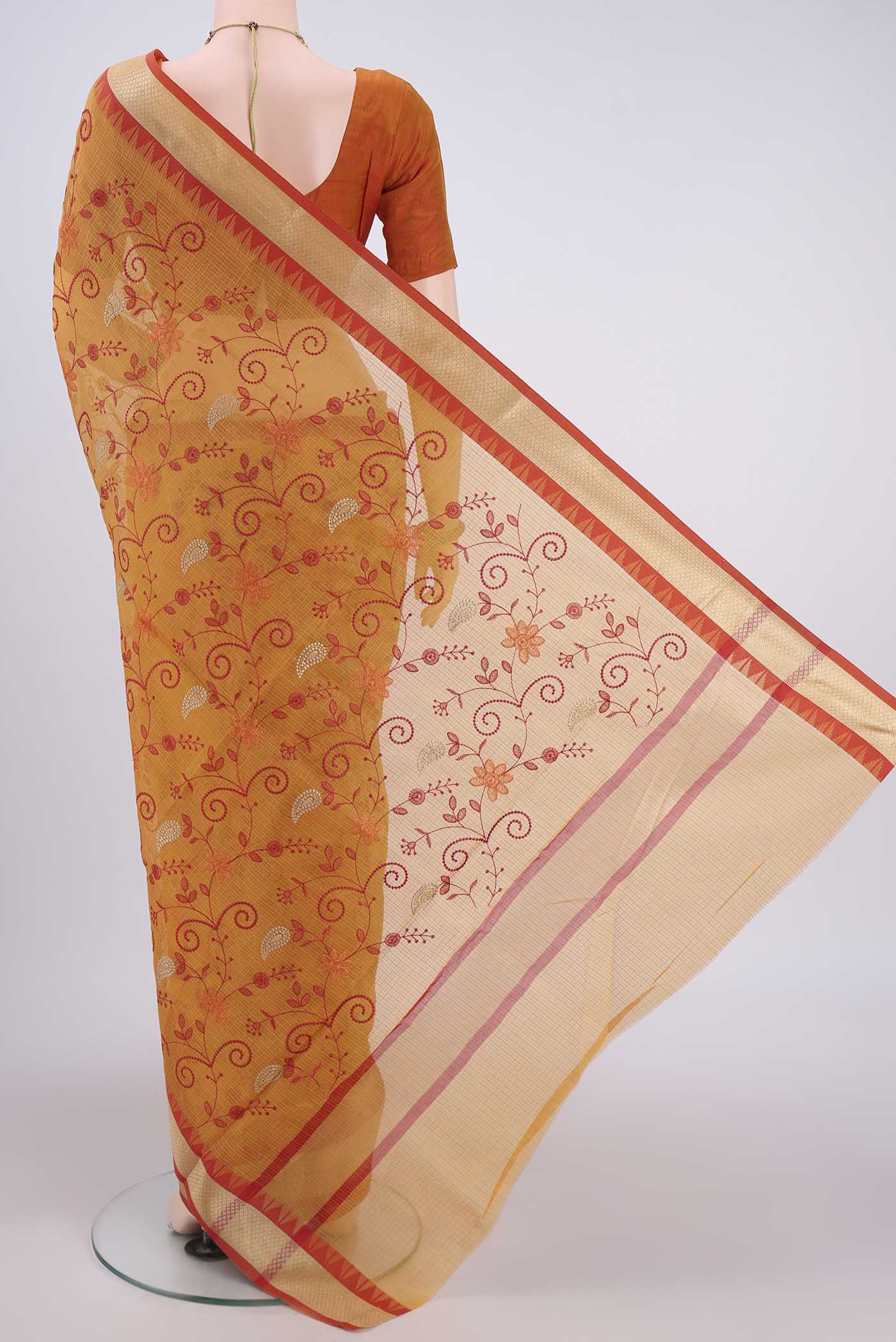 Flat view of Mustard Kota Silk Saree with Embroidery on the body and Plain Border. 
