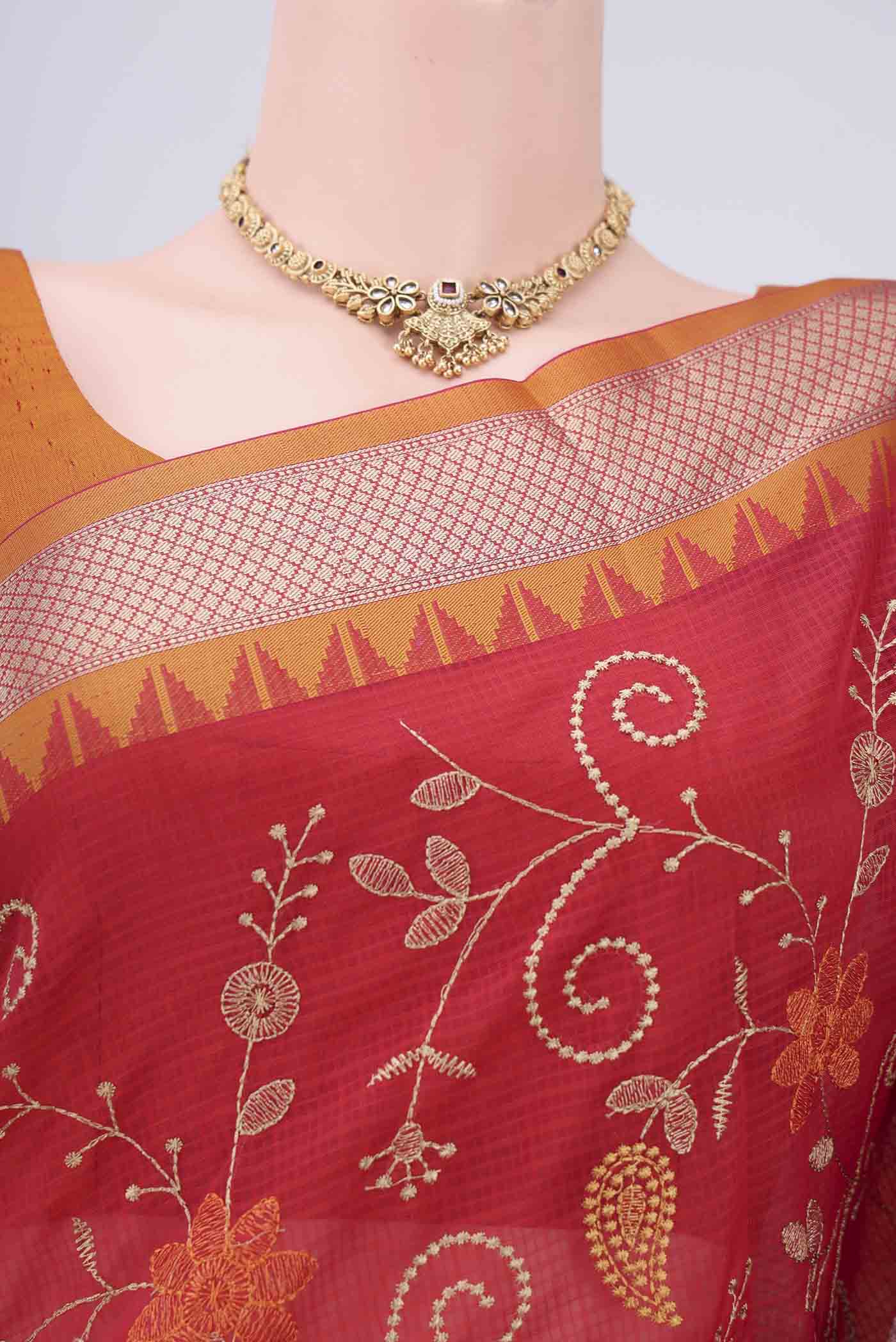 Border image of Red Kota Silk Saree with Embroidery on the body and Plain Border. 