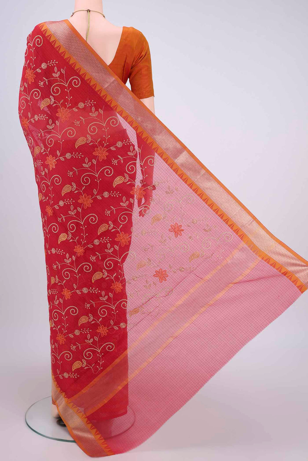 Flat view of Red Kota Silk Saree with Embroidery on the body and Plain Border. 