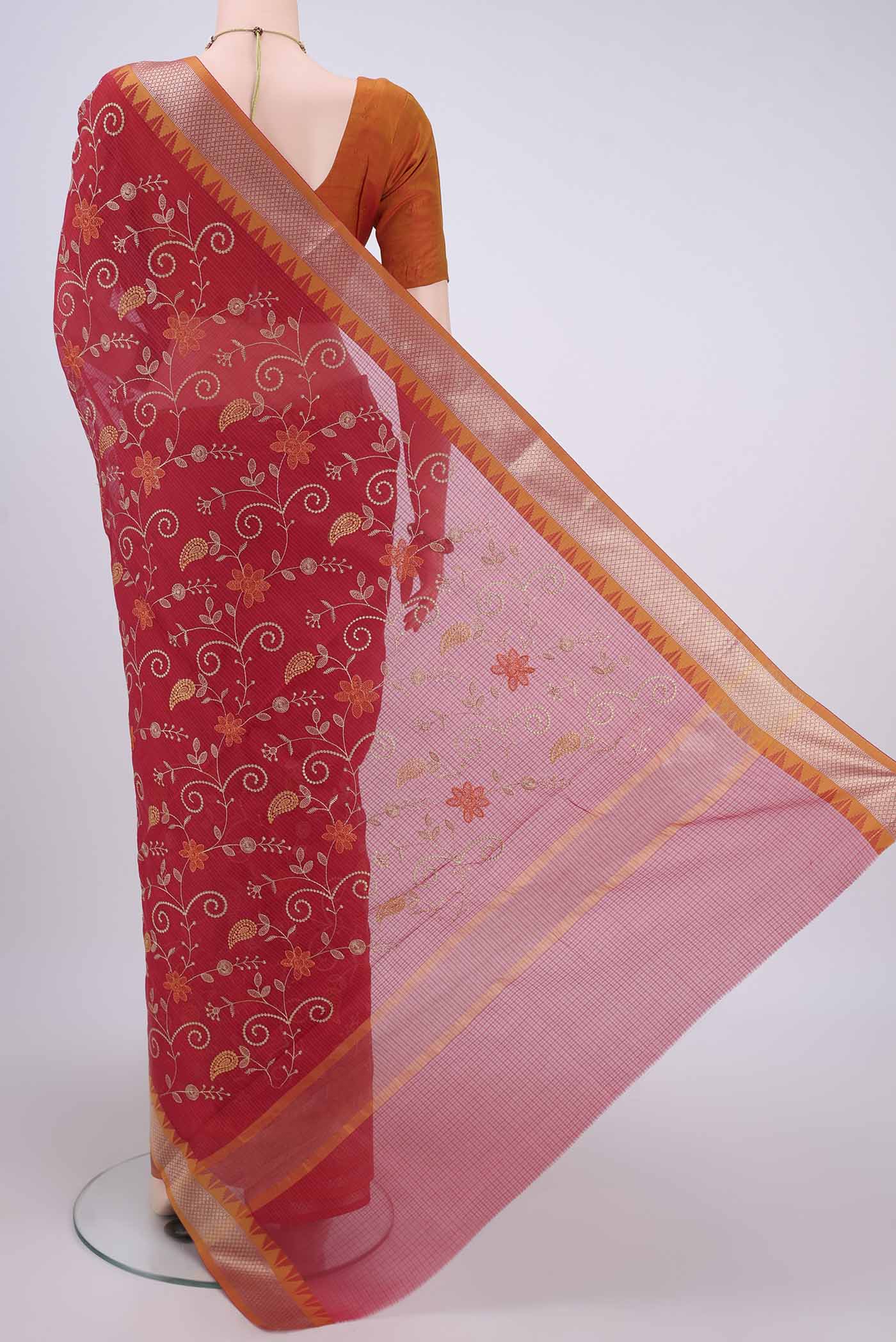 Flat view of Red Kota Silk Saree with Embroidery on the body and Plain Border. 