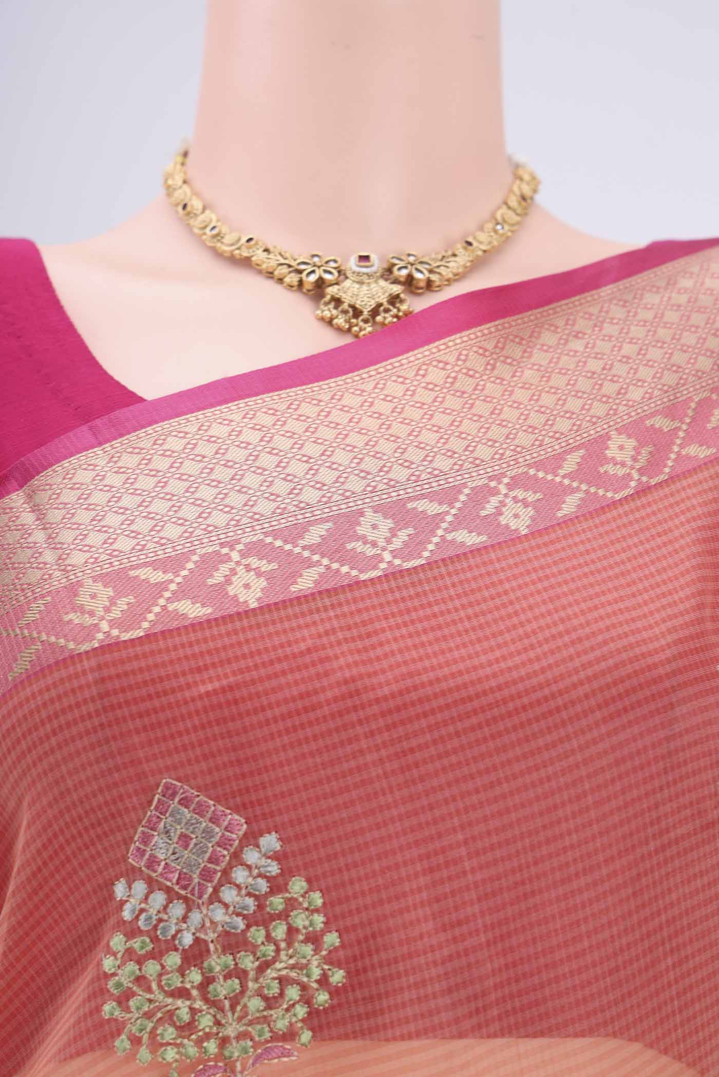 Border image of Peach Kota Silk Saree with Embroidery on the body and Plain Border. 