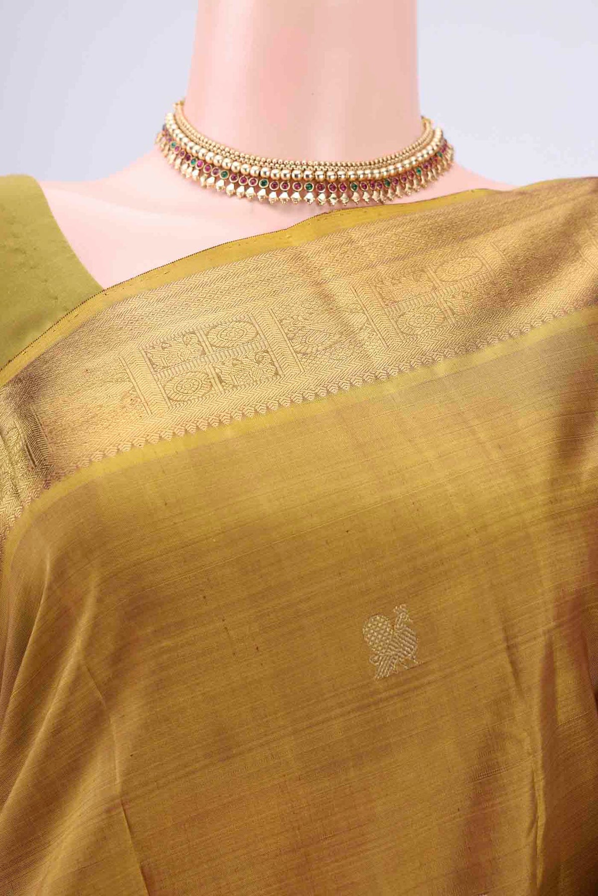 Border image of Pure Silk Pure Zari Mehandi Green Kanjivaram Saree with Zari Butta on the body and Zari Border. 